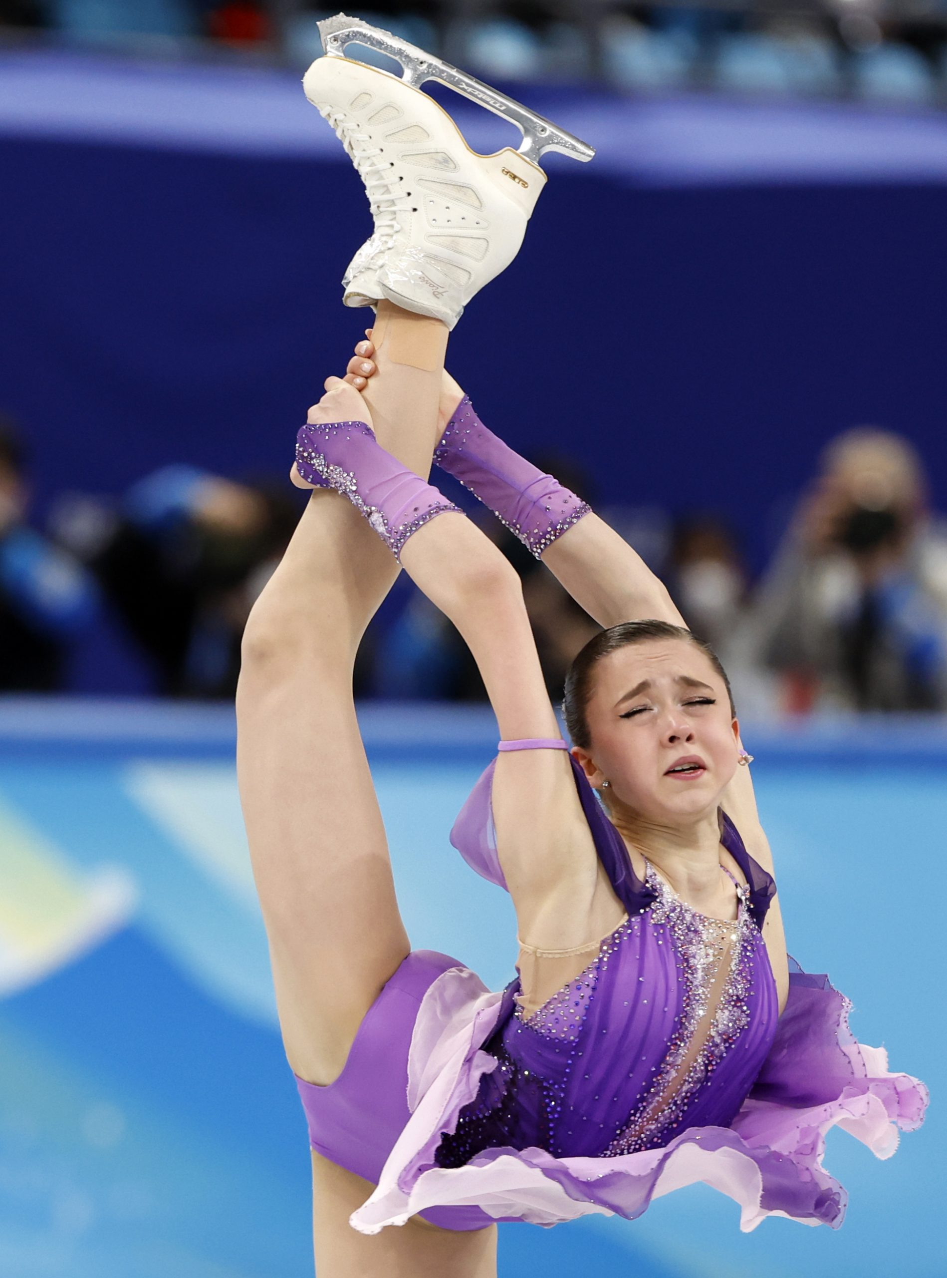 epa09759326 Kamila Valieva of Russia performs in the Women's Short Program of the Figure Skating events at the Beijing 2022 Olympic Games, Beijing, China, 15 February 2022.  EPA-EFE/HOW HWEE YOUNG