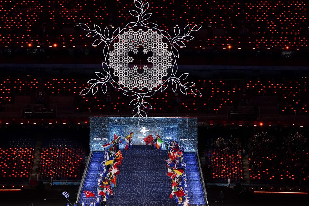 Teams arrives at the closing ceremony of the 2022 Winter Olympics, Sunday, Feb. 20, 2022, in Beijing. (AP Photo/Brynn Anderson)