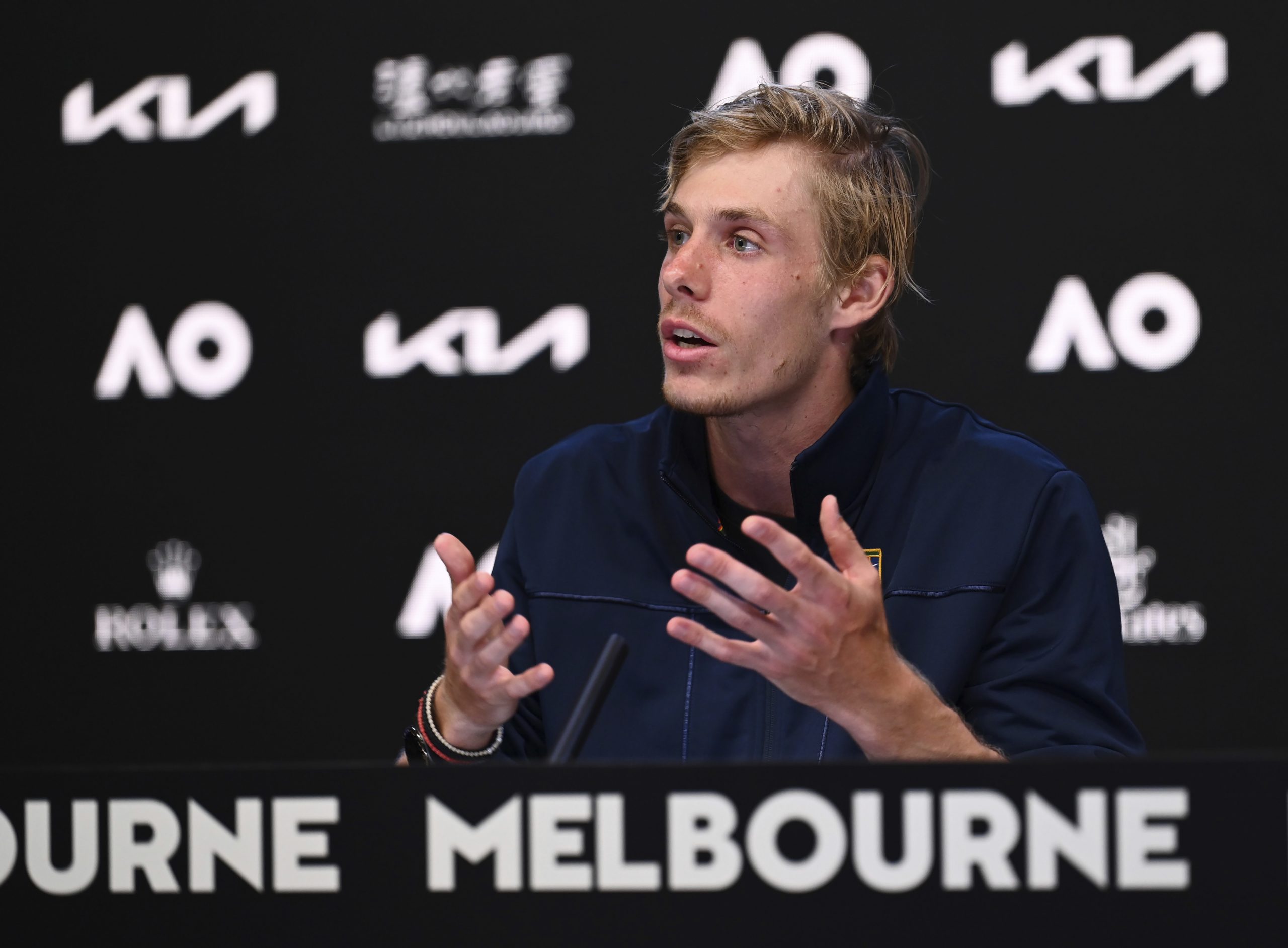 Denis Shapovalov of Canada gestures during a press conference following his quarterfinal loss to Rafael Nadal of Spain at the Australian Open tennis championships in Melbourne, Australia, Tuesday, Jan. 25. 2022. (Vince Caligiuri/Tennis Australia via AP)