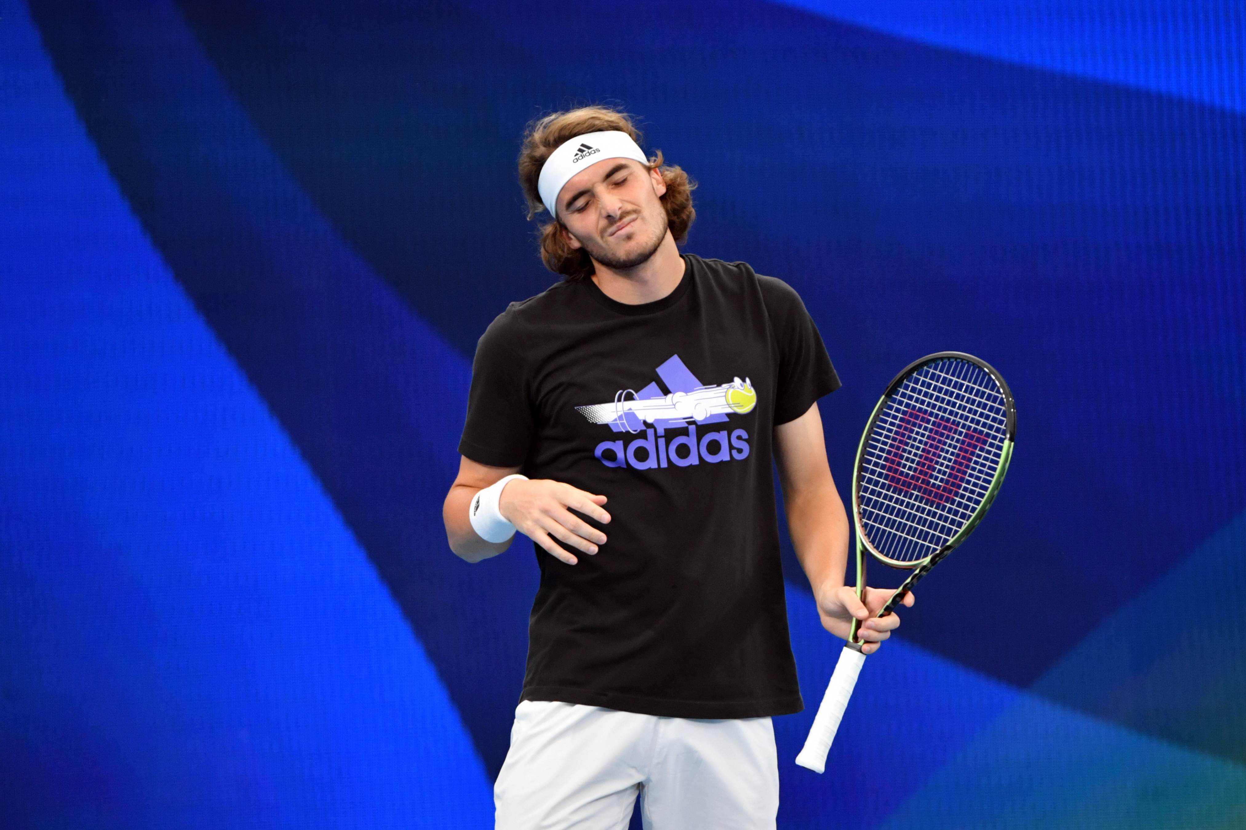 epa09660242 Stefanos Tsitsipas from Greece in action during an ATP Cup practice session at Ken Rosewall Arena, Sydney Olympic Park, in Sydney, Australia, 30 December  2021.  EPA-EFE/MICK TSIKAS  AUSTRALIA AND NEW ZEALAND OUT