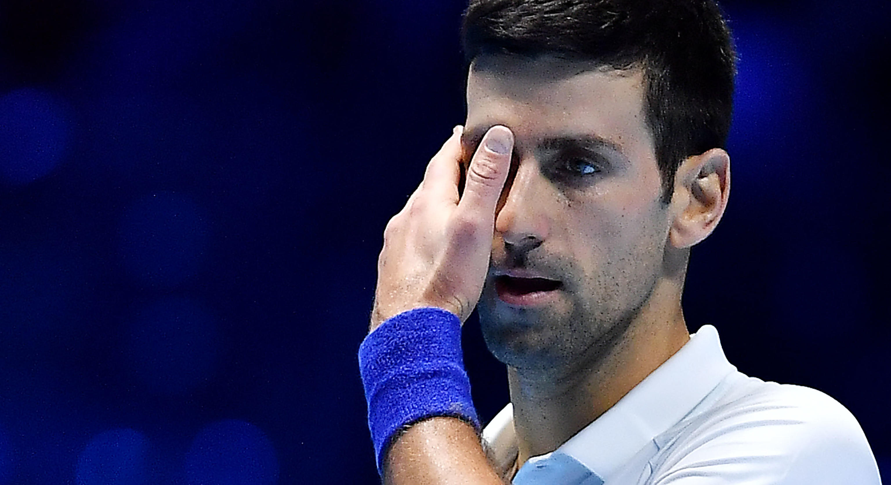 epa09594982 Novak Djokovic of Serbia reacts during the semi final match against Alexander Zverev of Germany of the Nitto ATP Finals tennis tournament in Turin, Italy, 20 November 2021.  EPA-EFE/ALESSANDRO DI MARCO