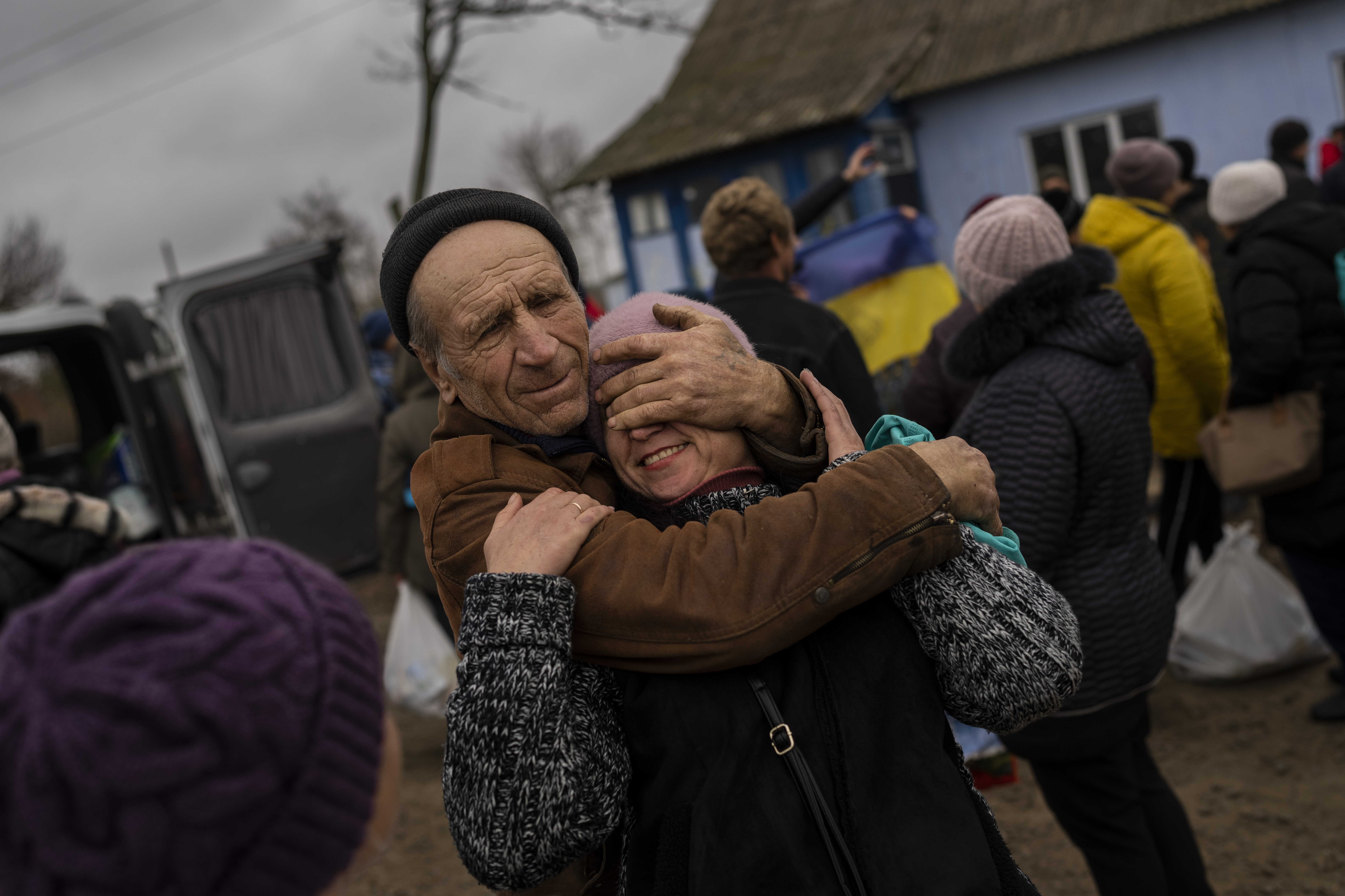Ukrainian family members reunite for the first time since Russian troops withdraw from the Kherson region in the village of Tsentralne, southern Ukraine, on Nov. 13, 2022. (AP Photo/Bernat Armangue)