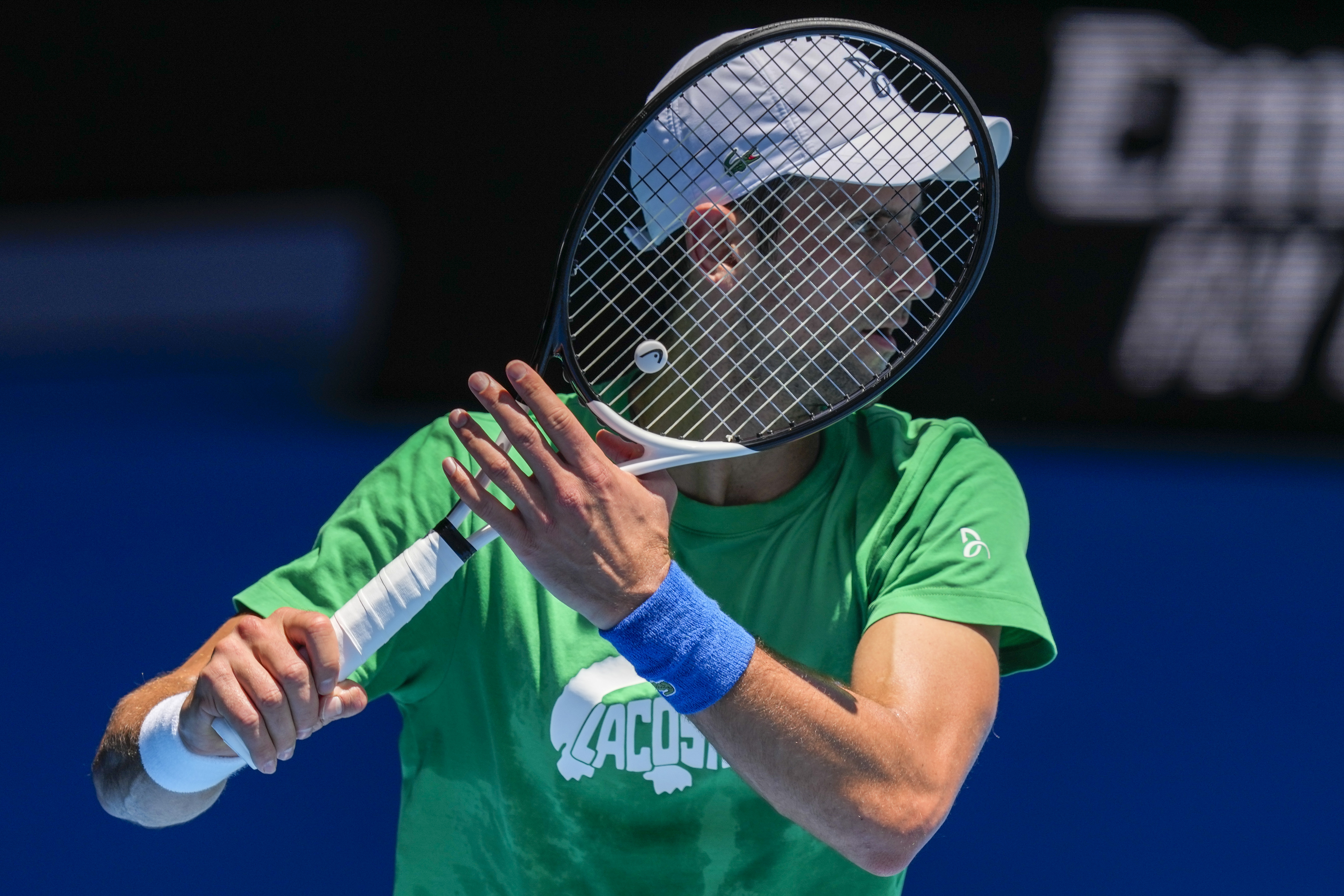 Defending men's champion Serbia's Novak Djokovic practices on Margaret Court Arena ahead of the Australian Open tennis championship in Melbourne, Australia, Thursday, Jan. 13, 2022. AP Photo/Mark Baker)