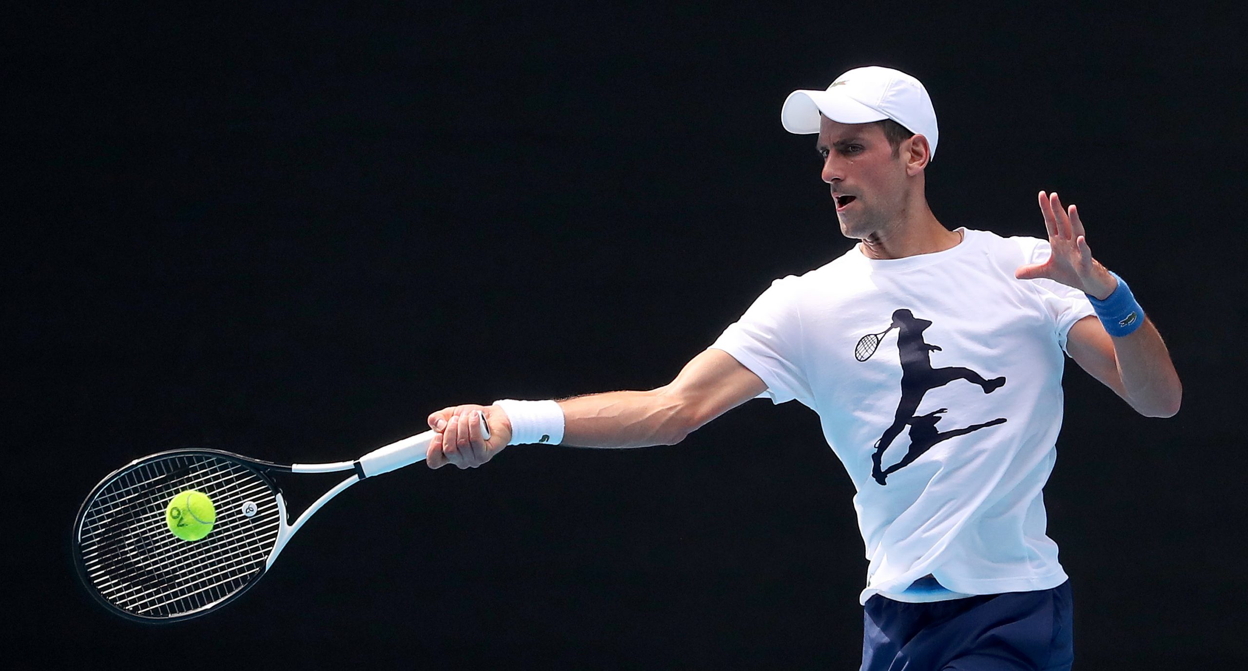 epa09678479 Novak Djokovic of Serbia during a practice session ahead of the Australian Open, at Melbourne Park in Melbourne, Victoria, Australia, 11 January 2022.  EPA-EFE/KELLY DEFINA / POOL  AUSTRALIA AND NEW ZEALAND OUT