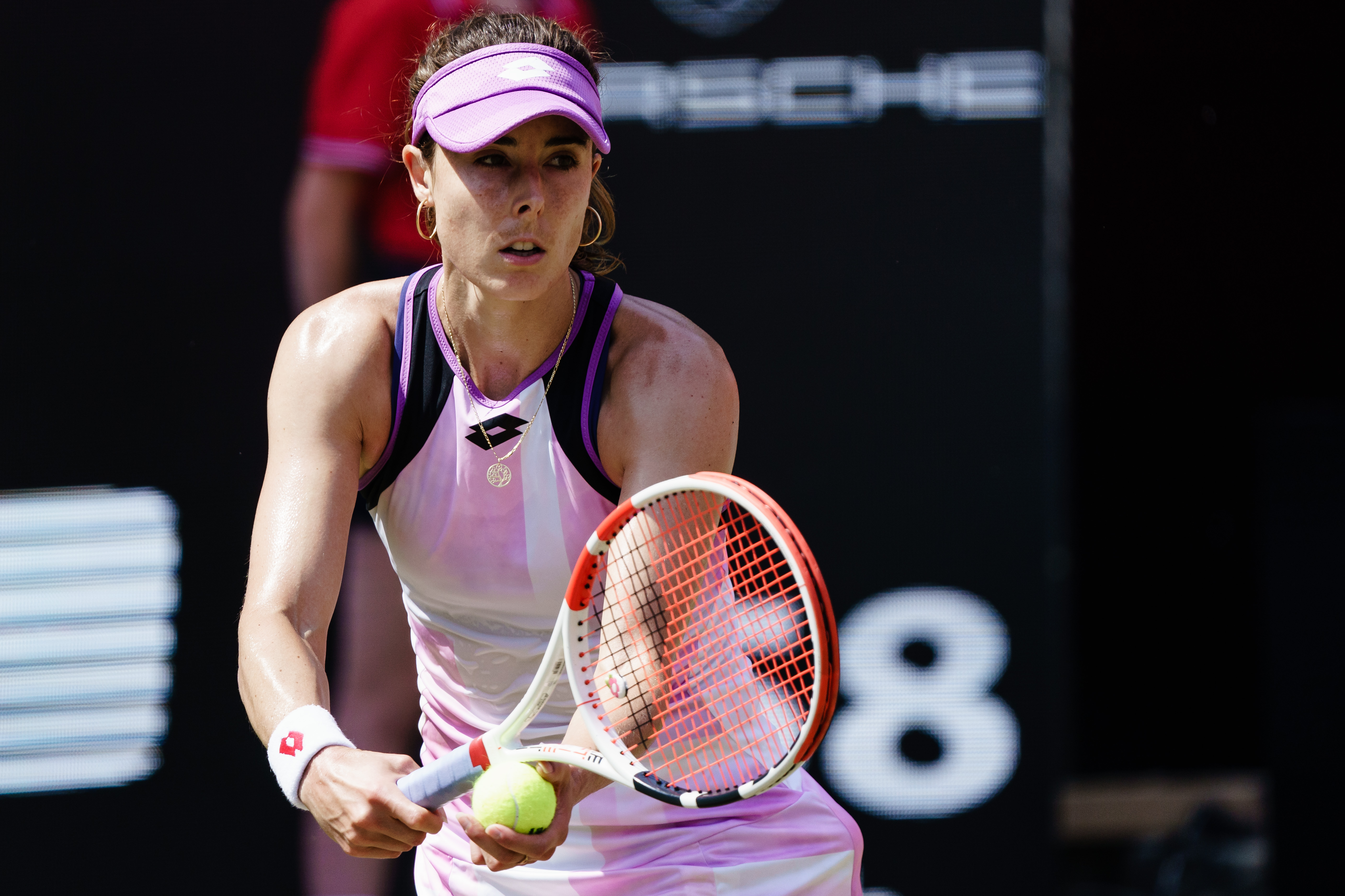 epa09285184 Alize Cornet of France serves against Belinda Bencic of Switzerland during the semifinals of the women's Bett1 Open WTA 500 tennis tournament in Berlin, Germany, 19 June 2021.  EPA-EFE/CLEMENS BILAN