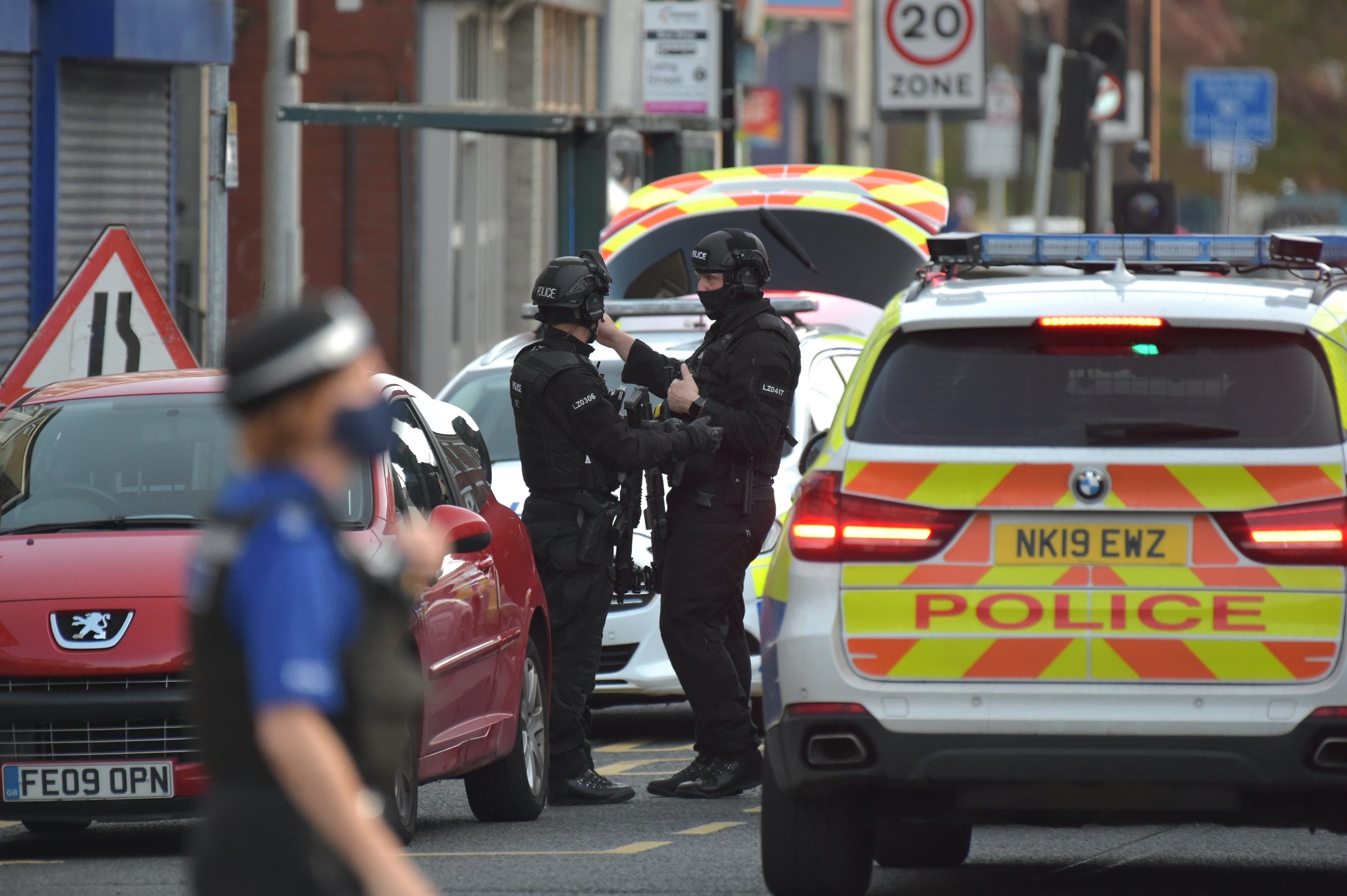 Armed Police Swarm Street as witnesses hear 'Threats to shoot'