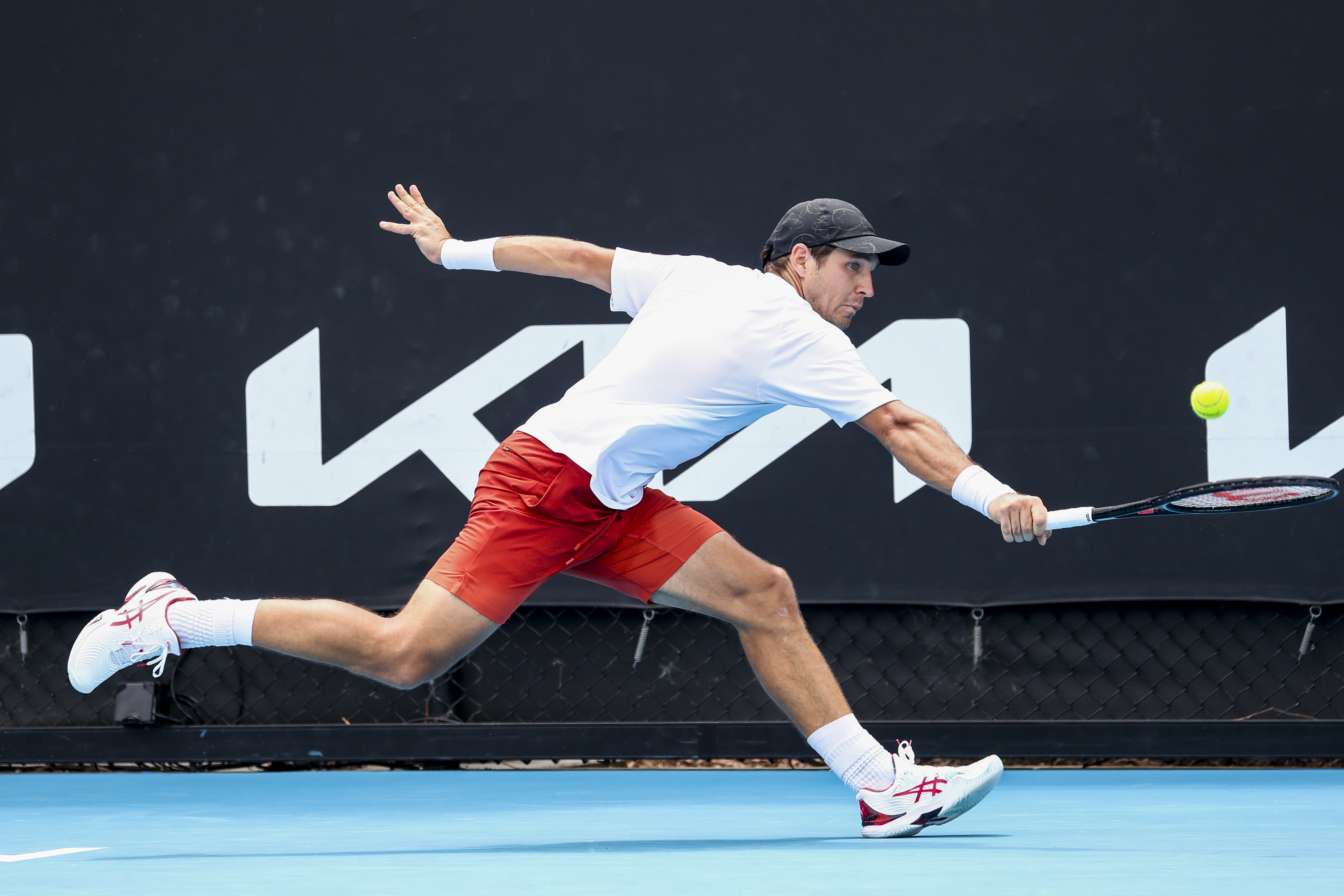 epa09690416 Dusan Lajovic of Serbia in action against Marton Fucsovics of Hungary during their first round match at the Australian Open Grand Slam tennis tournament in Melbourne, Australia, 17 January 2022.  EPA-EFE/JASON O'BRIEN