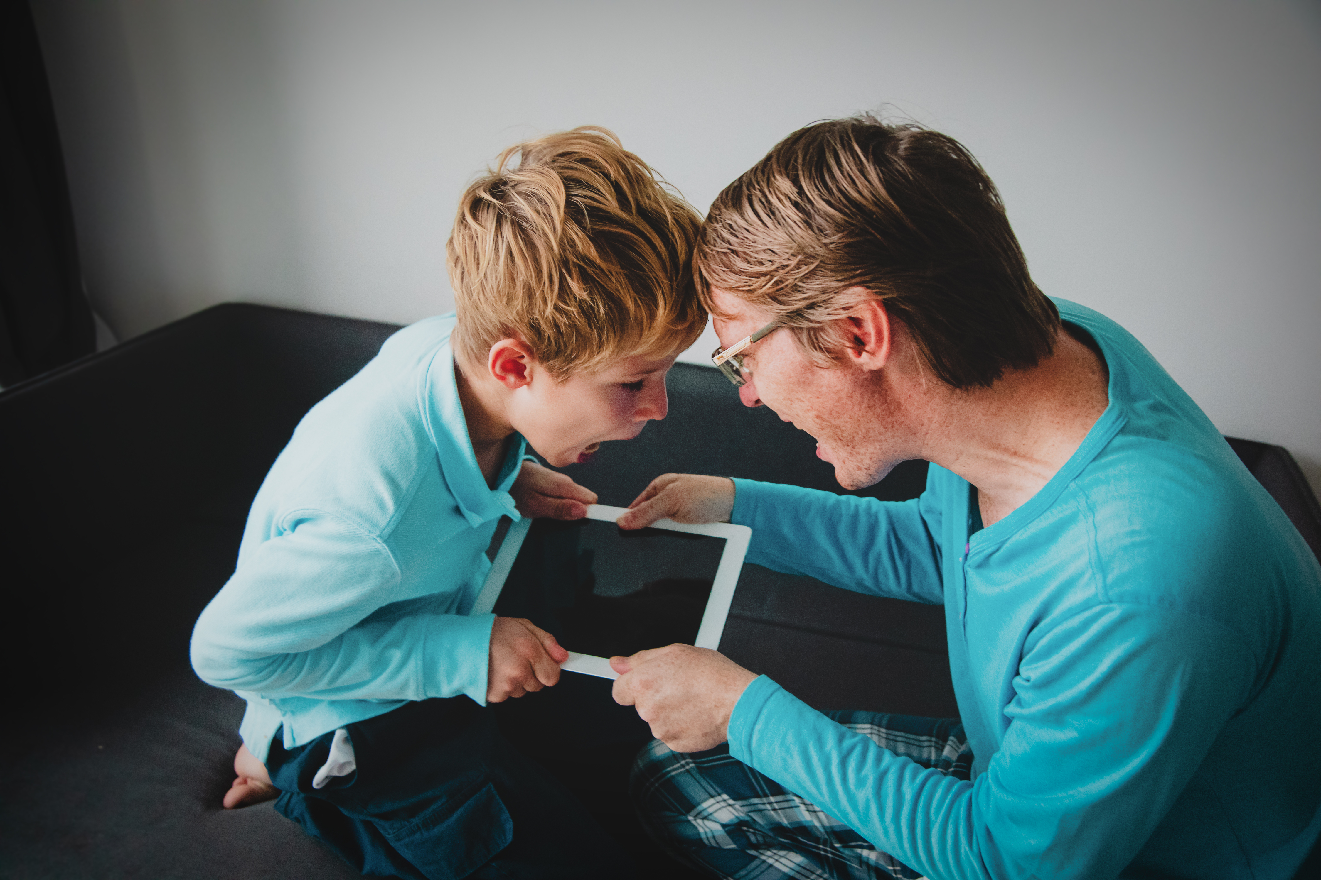 Internet,Addiction-,Father,Taking,Touch,Pad,From,Angry,Child