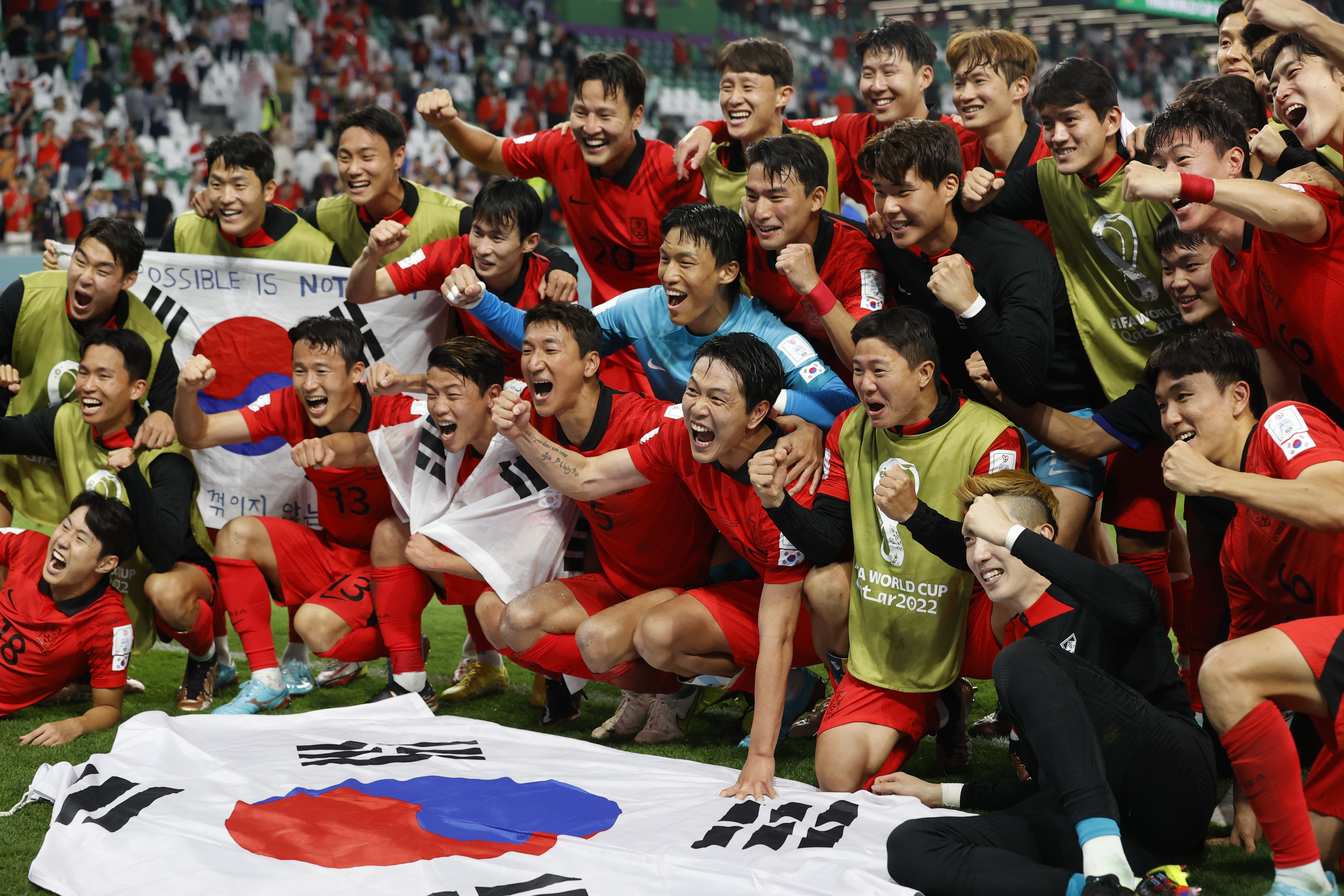 epa10344654 Players of South Korea celebrate their qualification to the next round after the FIFA World Cup 2022 group H soccer match between South Korea and Portugal at Education City Stadium in Doha, Qatar, 02 December 2022.  EPA-EFE/Rungroj Yongrit