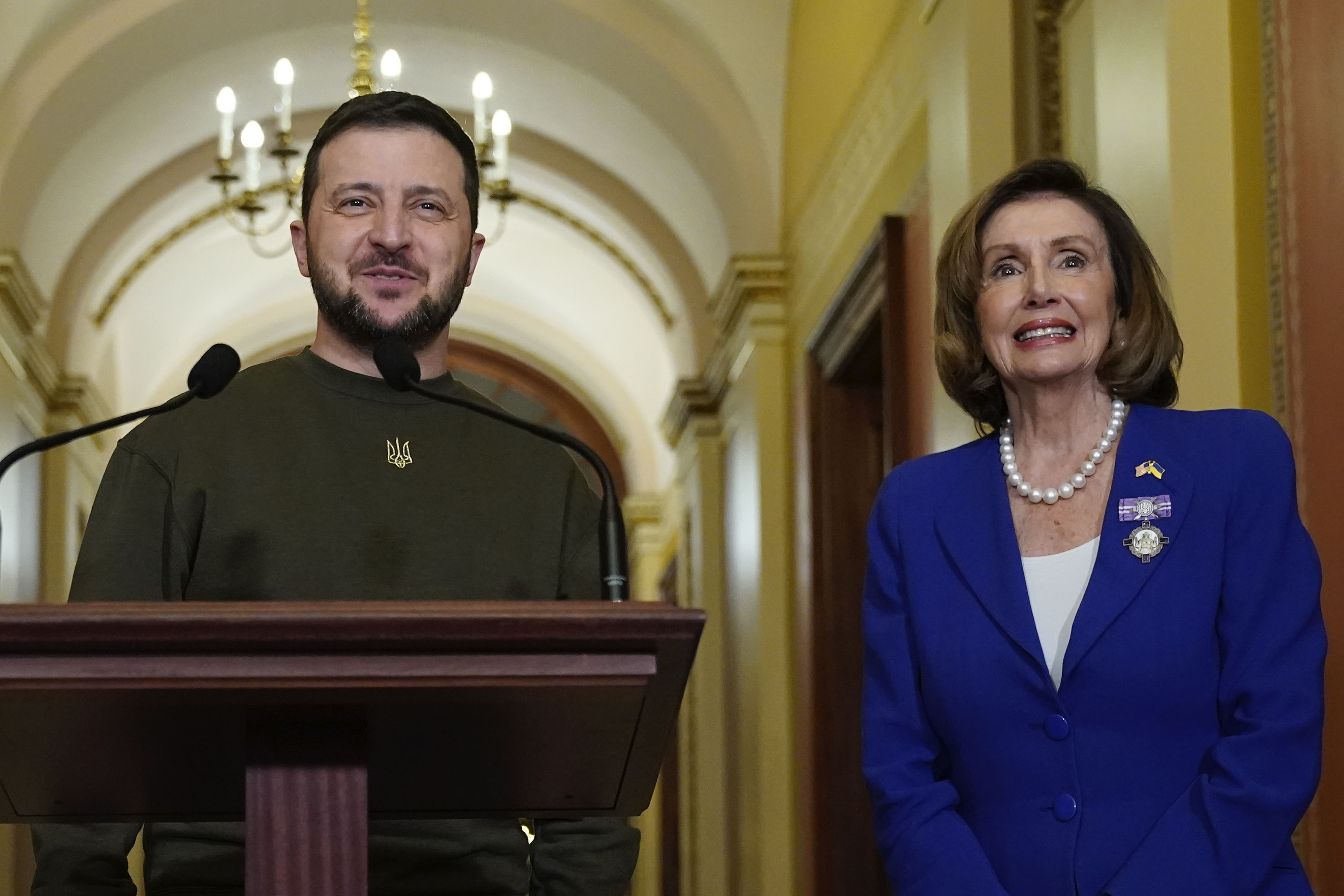 Ukraine's President Volodymyr Zelenskyy, left, meets with Speaker of the House Nancy Pelosi, of Calif., right, Wednesday, Dec. 21, 2022, at the Capitol in Washington. (AP Photo/Jacquelyn Martin)
