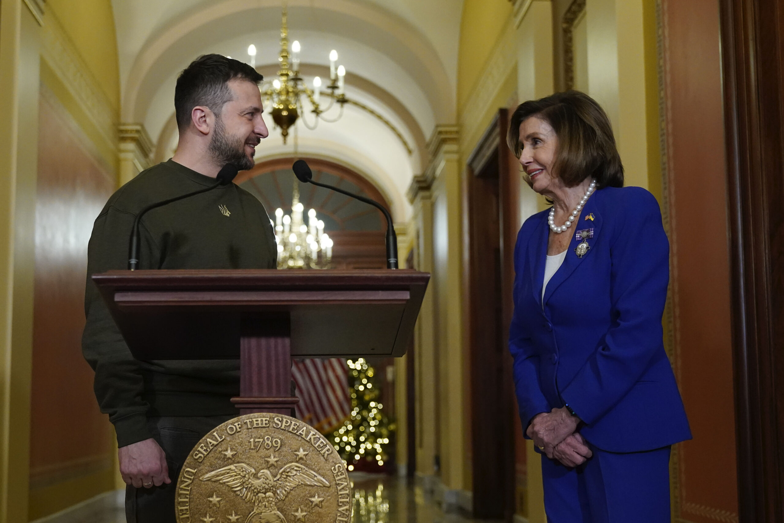 Ukraine's President Volodymyr Zelenskyy, left, meets with Speaker of the House Nancy Pelosi, of Calif., right, Wednesday, Dec. 21, 2022, at the Capitol in Washington. (AP Photo/Jacquelyn Martin)
