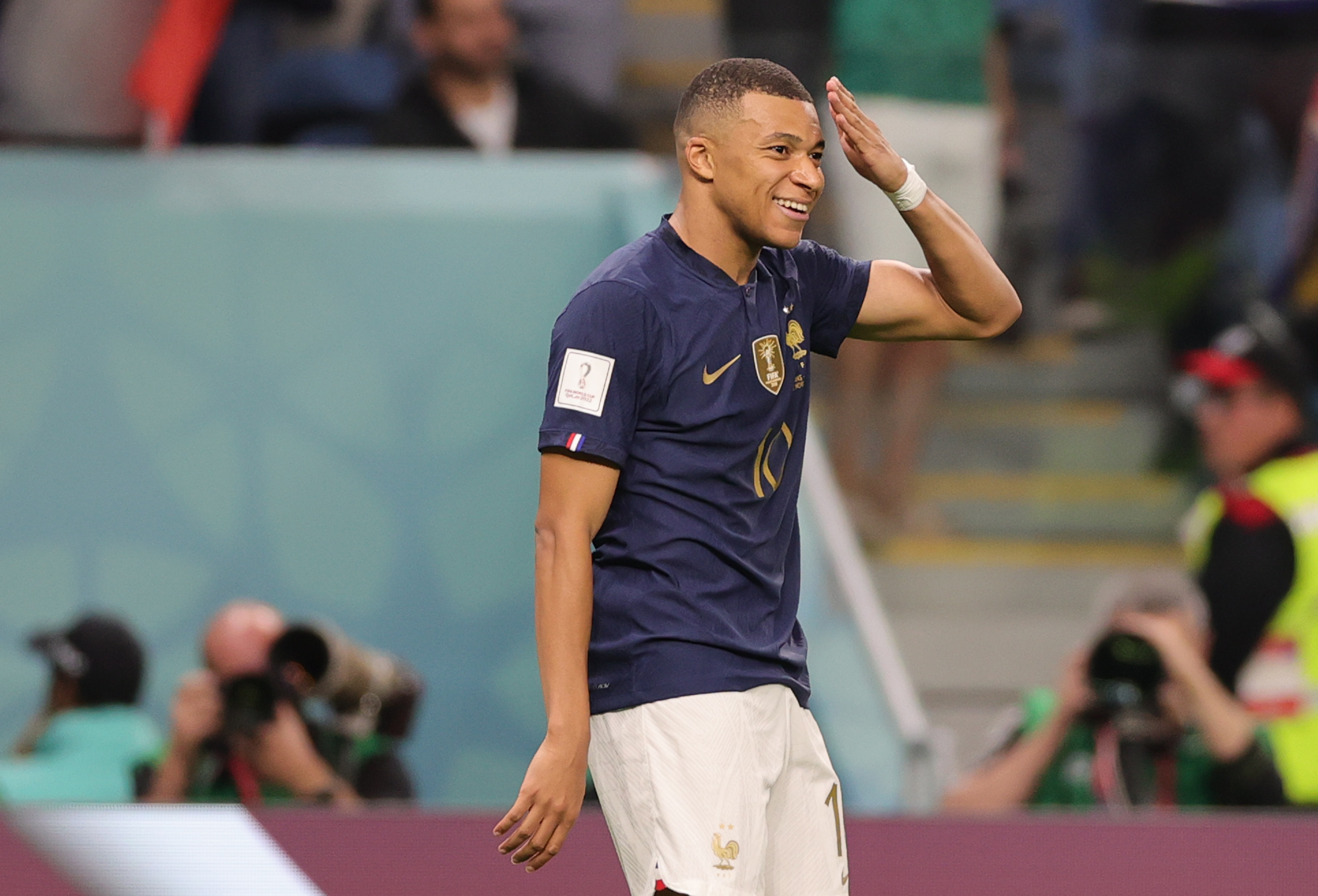 epa10321417 Kylian Mbappe of France celebrates scoring the 3-1 during the FIFA World Cup 2022 group D soccer match between France and Australia at Al Janoub Stadium in Al Wakrah, Qatar, 22 November 2022.  EPA-EFE/Friedemann Vogel