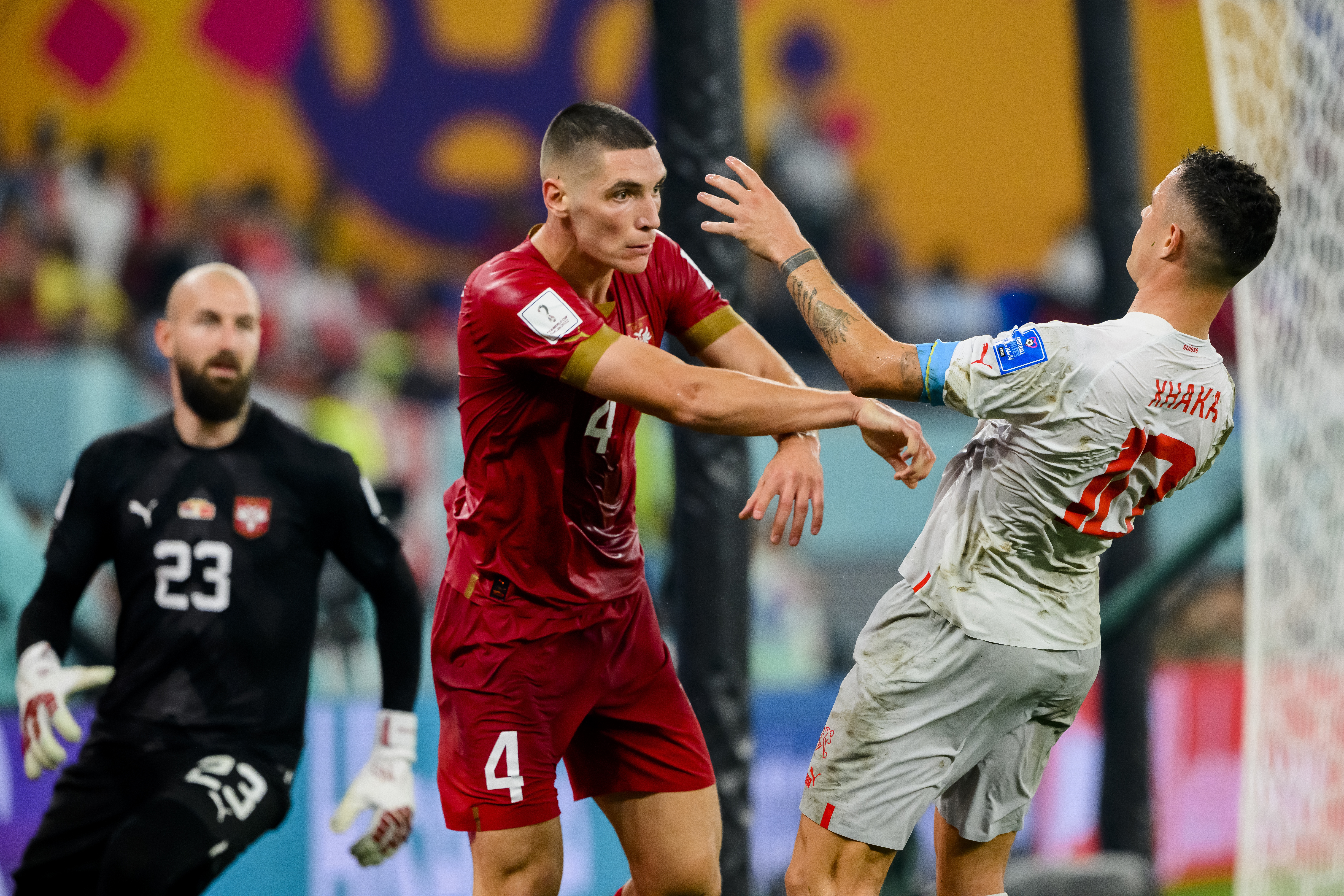 epa10345470 Switzerland's Granit Xhaka (R) scuffles with Serbia's Nikola Milenkovic (C) during the FIFA World Cup Qatar 2022 group G soccer match between Serbia and Switzerland at Stadium 974 in Doha, Qatar, 02 December 2022.  EPA-EFE/LAURENT GILLIERON