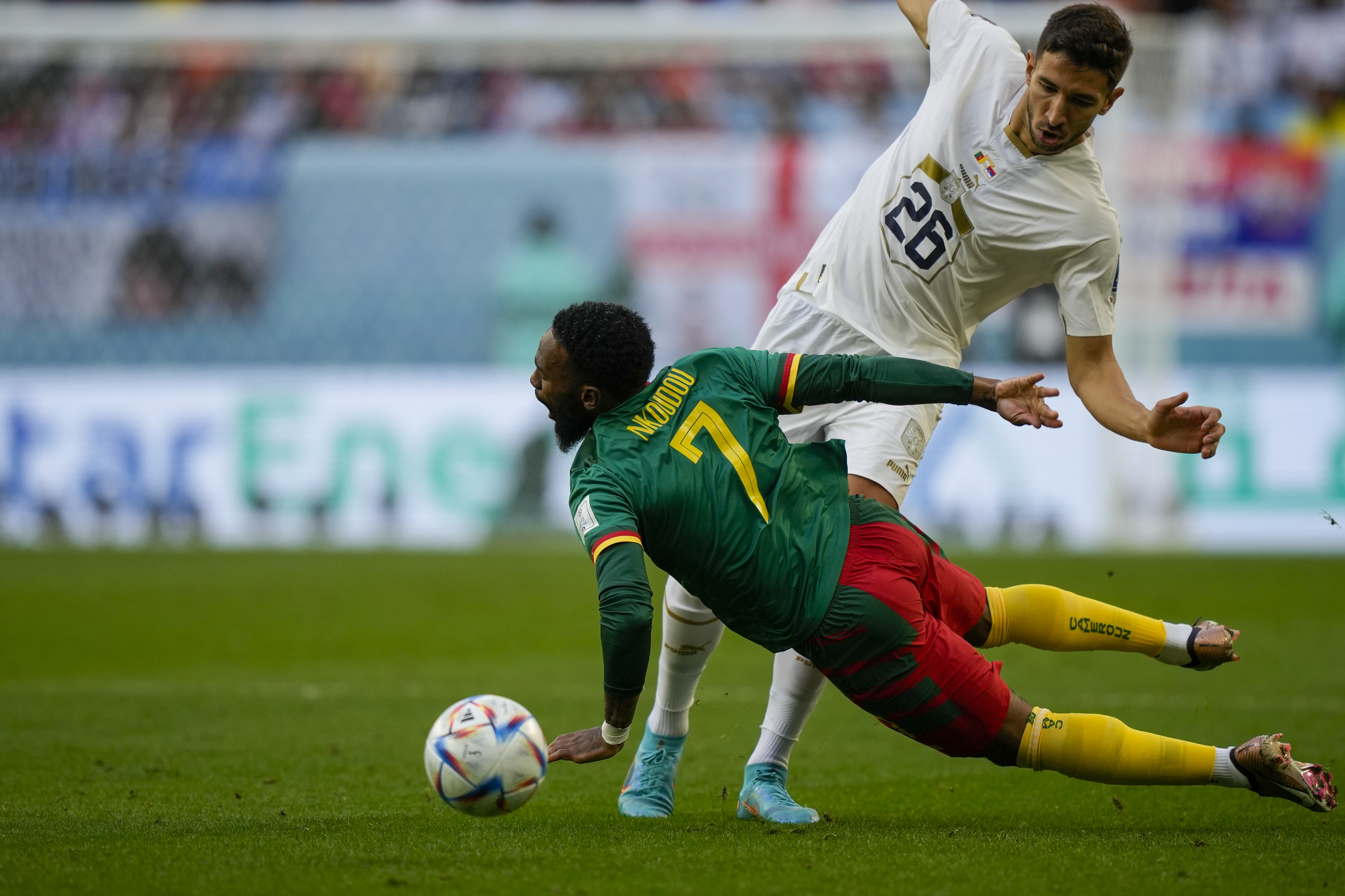 Cameroon's Georges-Kevin Nkoudou is challenged by Serbia's Marko Grujic, rear, during the World Cup group G soccer match between Cameroon and Serbia, at the Al Janoub Stadium in Al Wakrah, Qatar, Monday, Nov. 28, 2022. (AP Photo/Frank Augstein)