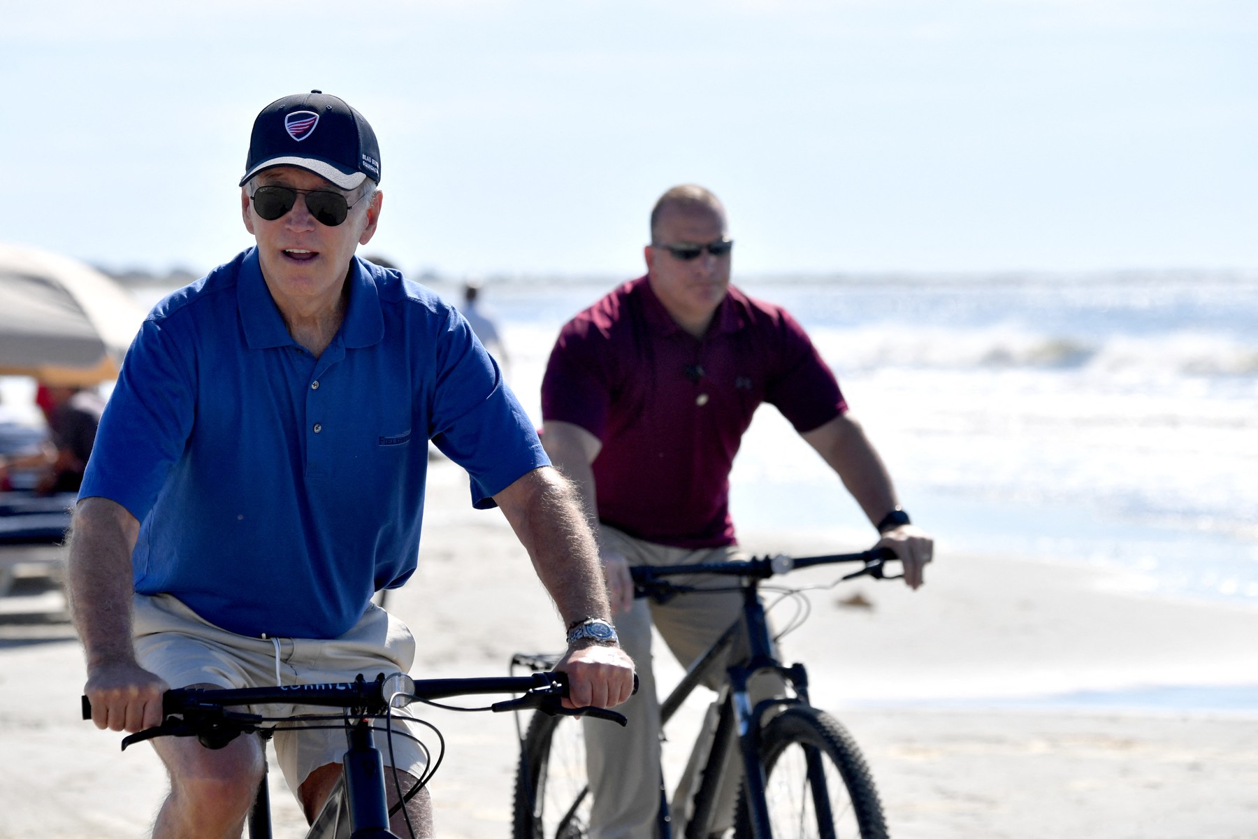 US President Joe Biden rides his bicycle along the beach while on vacation in Kiawah Island, South Carolina, on August 14, 2022.,Image: 713970084, License: Rights-managed, Restrictions: , Model Release: no, Credit line: Nicholas Kamm / AFP / Profimedia