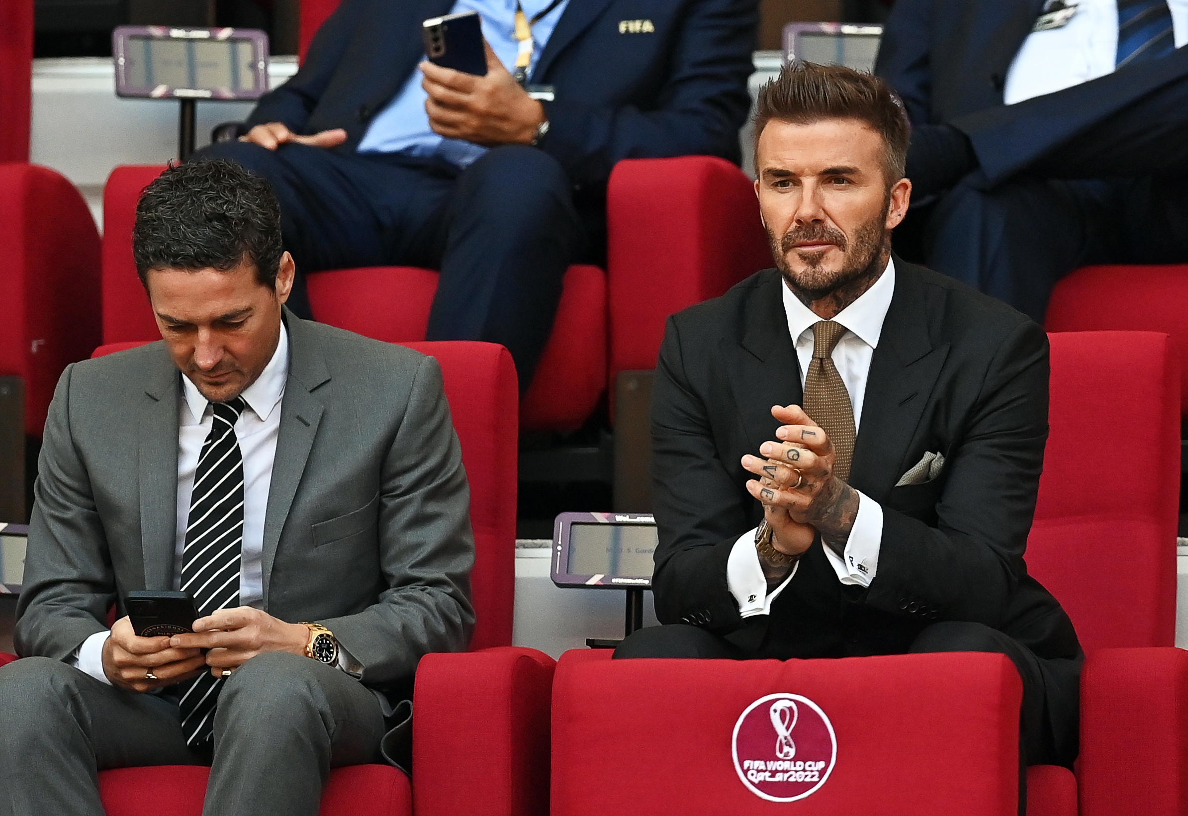 epa10317849 FIFA World Cup Qatar 2022 ambassador David Beckham (R) of England attends the FIFA World Cup 2022 group B soccer match between England and Iran at Khalifa International Stadium in Doha, Qatar, 21 November 2022.  EPA-EFE/Neil Hall