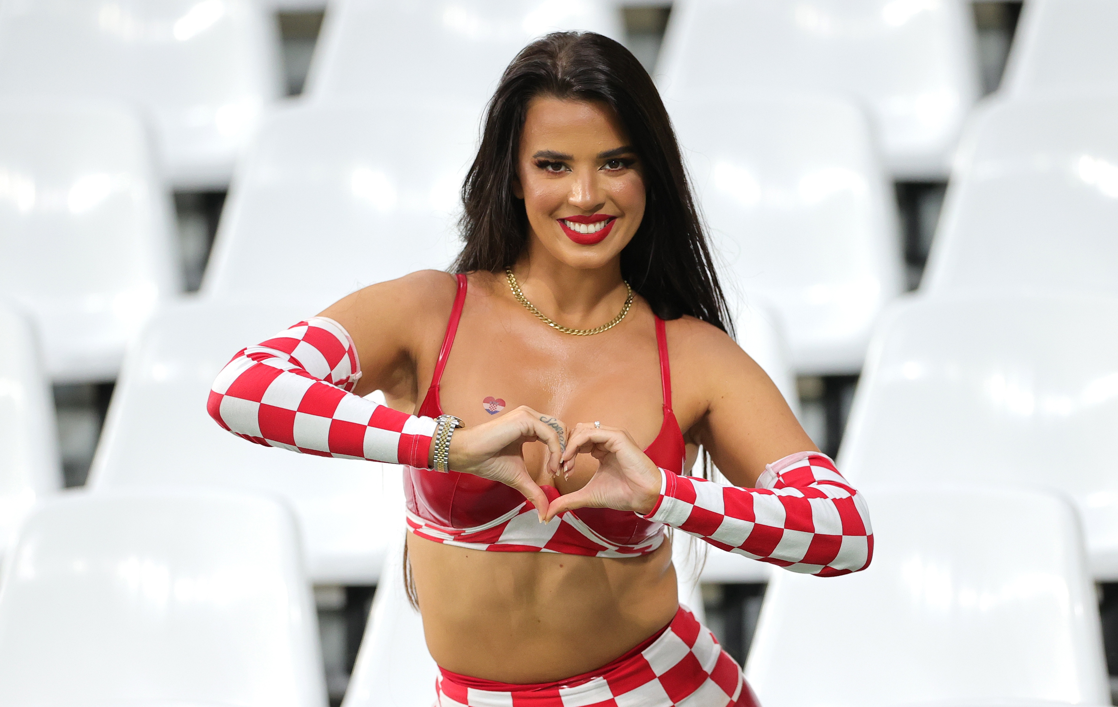 epa10356847 Croatian model Ivana Knoll poses in the stands for photos before the FIFA World Cup 2022 quarter final soccer match between Croatia and Brazil at Education City Stadium in Doha, Qatar, 09 December 2022.  EPA-EFE/Friedemann Vogel