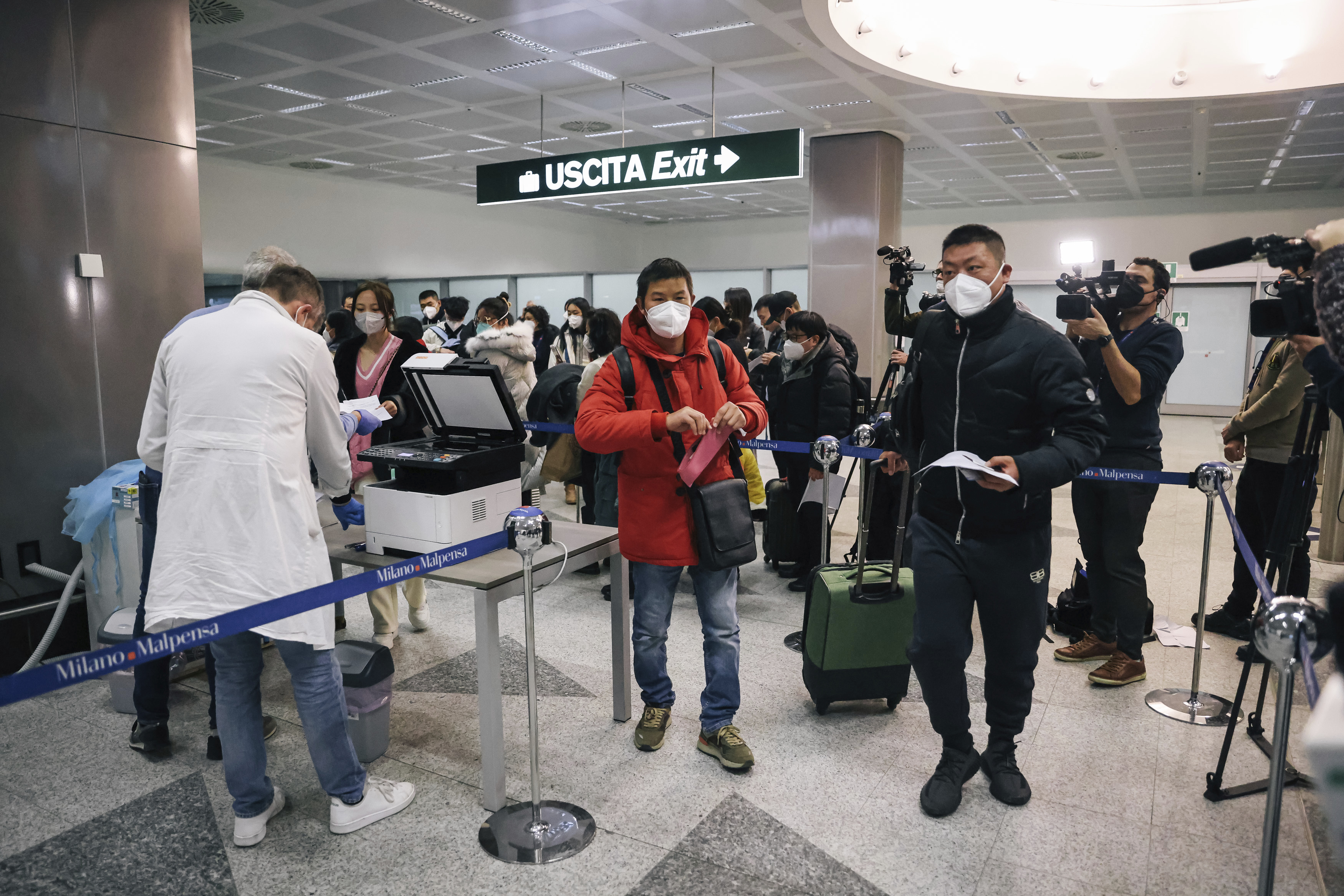 Passangers arriving from China are tested for COVID-19 on arrival at Milan Malpensa Airport, Milan, Italy, Thursday, Dec. 29, 2022. (Alessandro Bremec/LaPresse via AP)