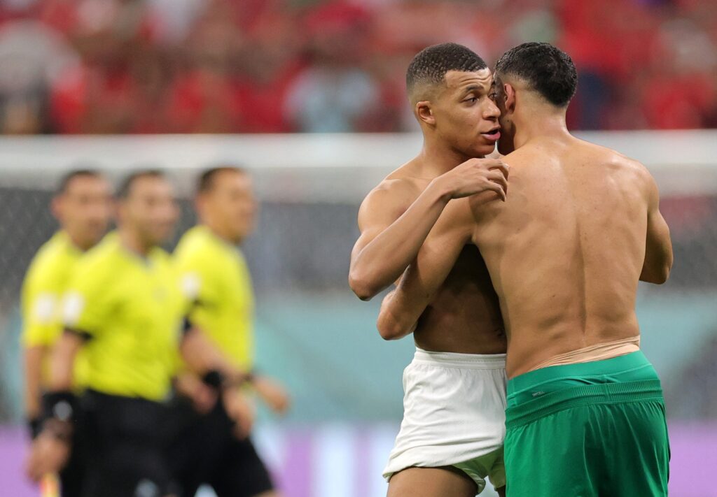 epa10366336 Kylian Mbappe (L) of France and Achraf Hakimi of Morocco react after the final whistle of the FIFA World Cup 2022 semi final between France and Morocco at Al Bayt Stadium in Al Khor, Qatar, 14 December 2022.  EPA-EFE/Friedemann Vogel