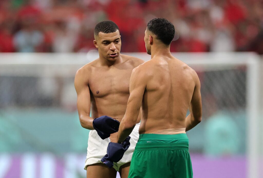 epa10366337 Kylian Mbappe (L) of France and Achraf Hakimi of Morocco react after the final whistle of the FIFA World Cup 2022 semi final between France and Morocco at Al Bayt Stadium in Al Khor, Qatar, 14 December 2022.  EPA-EFE/Friedemann Vogel