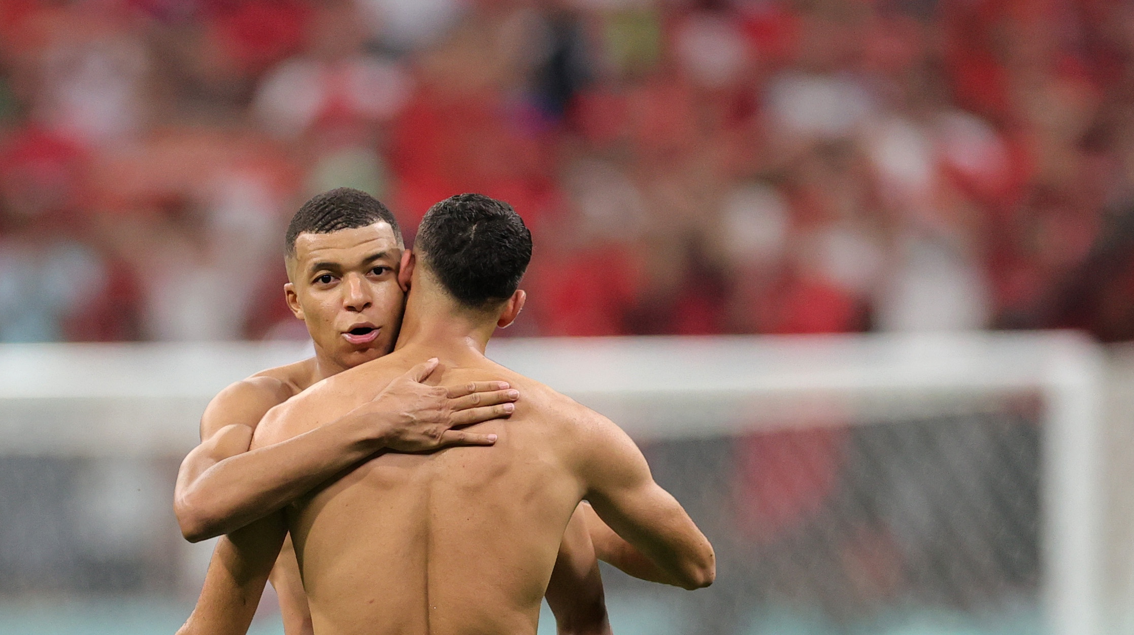epa10366352 Kylian Mbappe (L) of France and Achraf Hakimi of Morocco react after the final whistle of the FIFA World Cup 2022 semi final between France and Morocco at Al Bayt Stadium in Al Khor, Qatar, 14 December 2022.  EPA-EFE/Friedemann Vogel