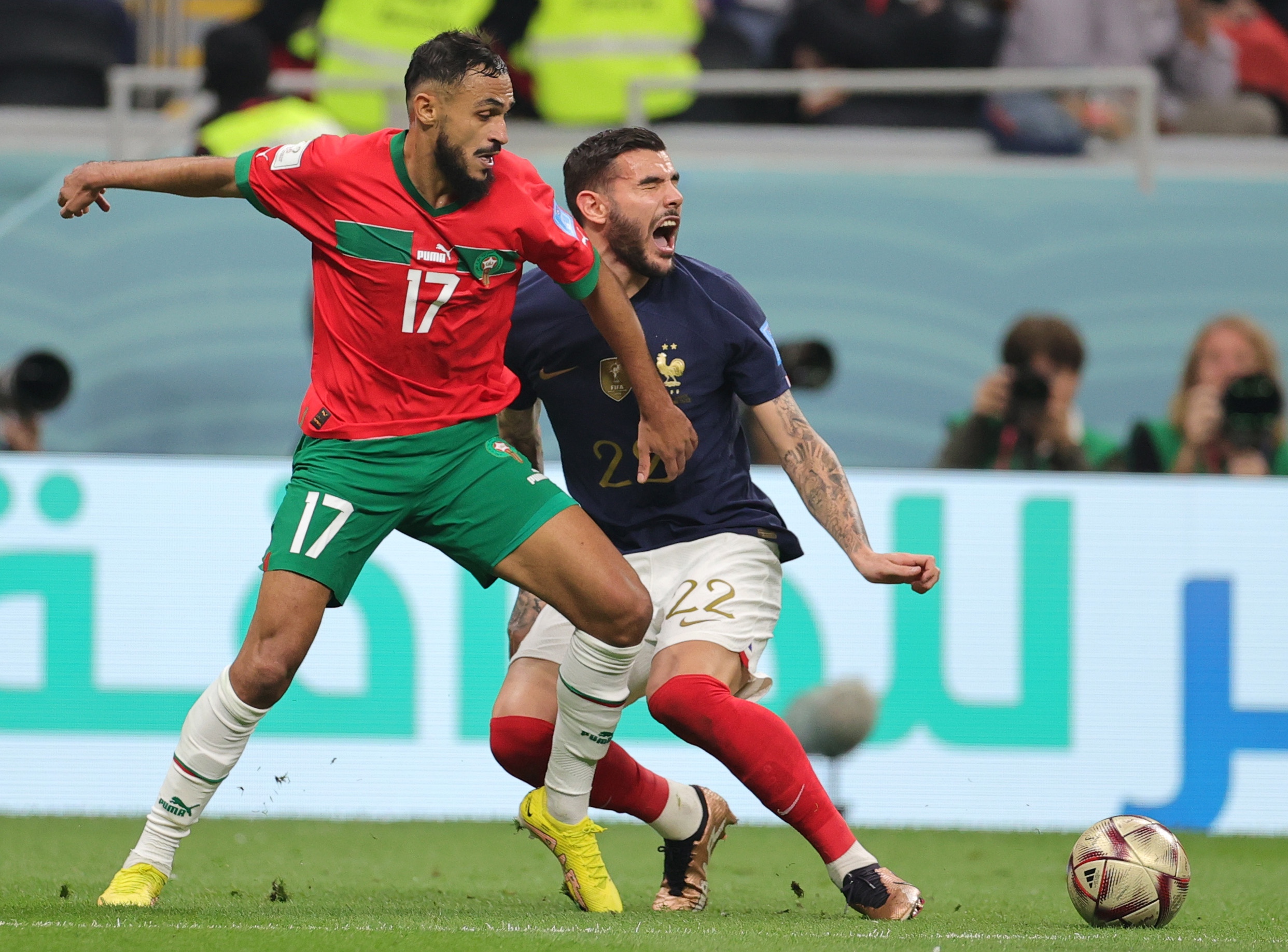 epa10365893 Theo Hernandez (R) of France in action against So ane Boufal of Morocco during the FIFA World Cup 2022 semi final between France and Morocco at Al Bayt Stadium in Al Khor, Qatar, 14 December 2022.  EPA-EFE/Friedemann Vogel