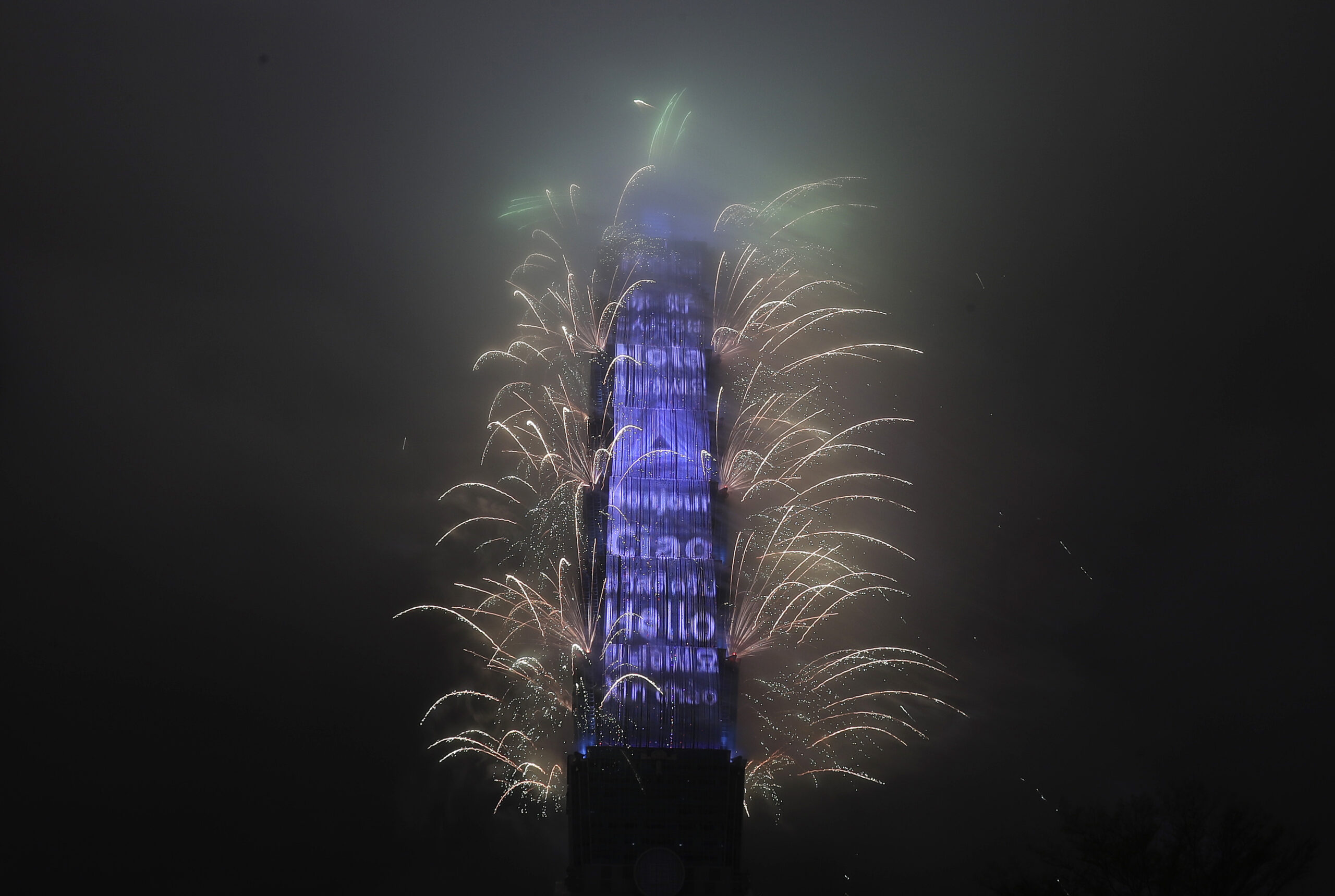 A firework display explodes off Taiwan's tallest skyscraper Taipei101 to usher in the New Year in Taipei, Taiwan, Sunday, Jan. 1, 2023. (AP Photo/Chiang Ying-ying)