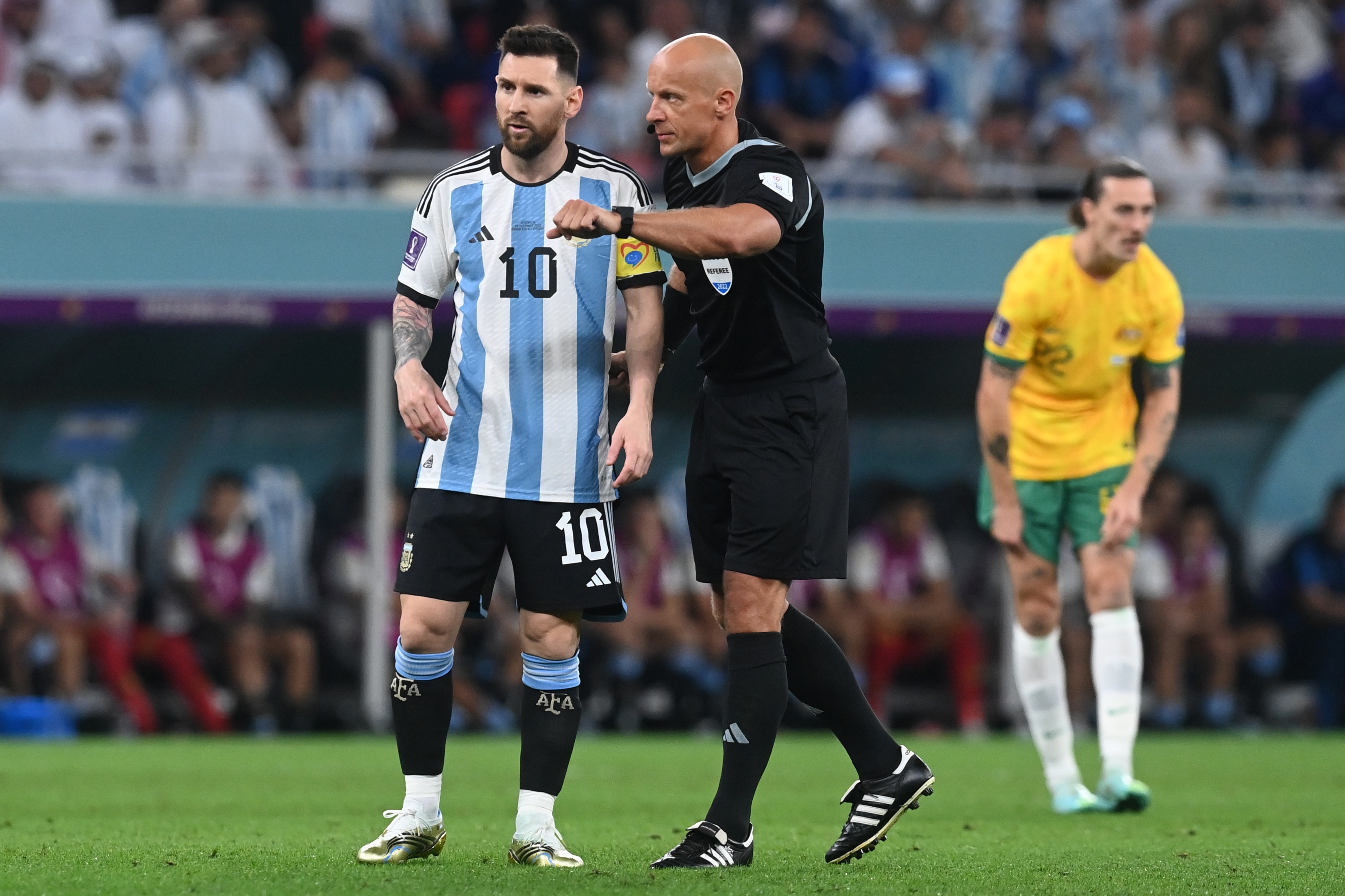 epa10346653 Polish referee Szymon Marciniak talks to Lionel Messi (L) of Argentina during the FIFA World Cup 2022 round of 16 soccer match between Argentina and Australia at Ahmad bin Ali Stadium in Doha, Qatar, 03 December 2022.  EPA-EFE/Neil Hall