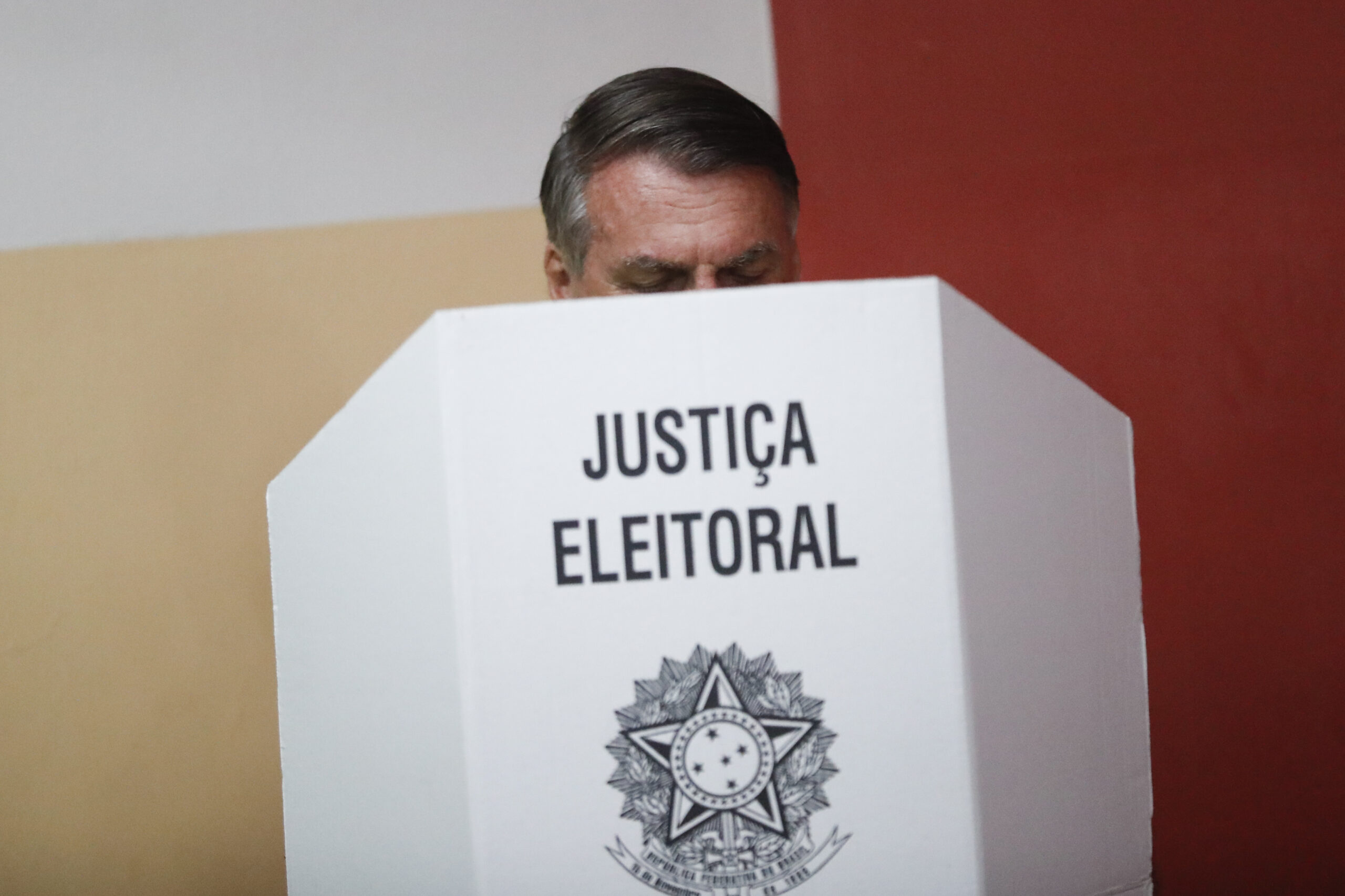 Brazilian President Jair Bolsonaro, who is running for another term, votes in a run-off presidential election in Rio de Janeiro, Brazil, Sunday, Oct. 30, 2022. (AP Photo/Bruna Prado, Pool)