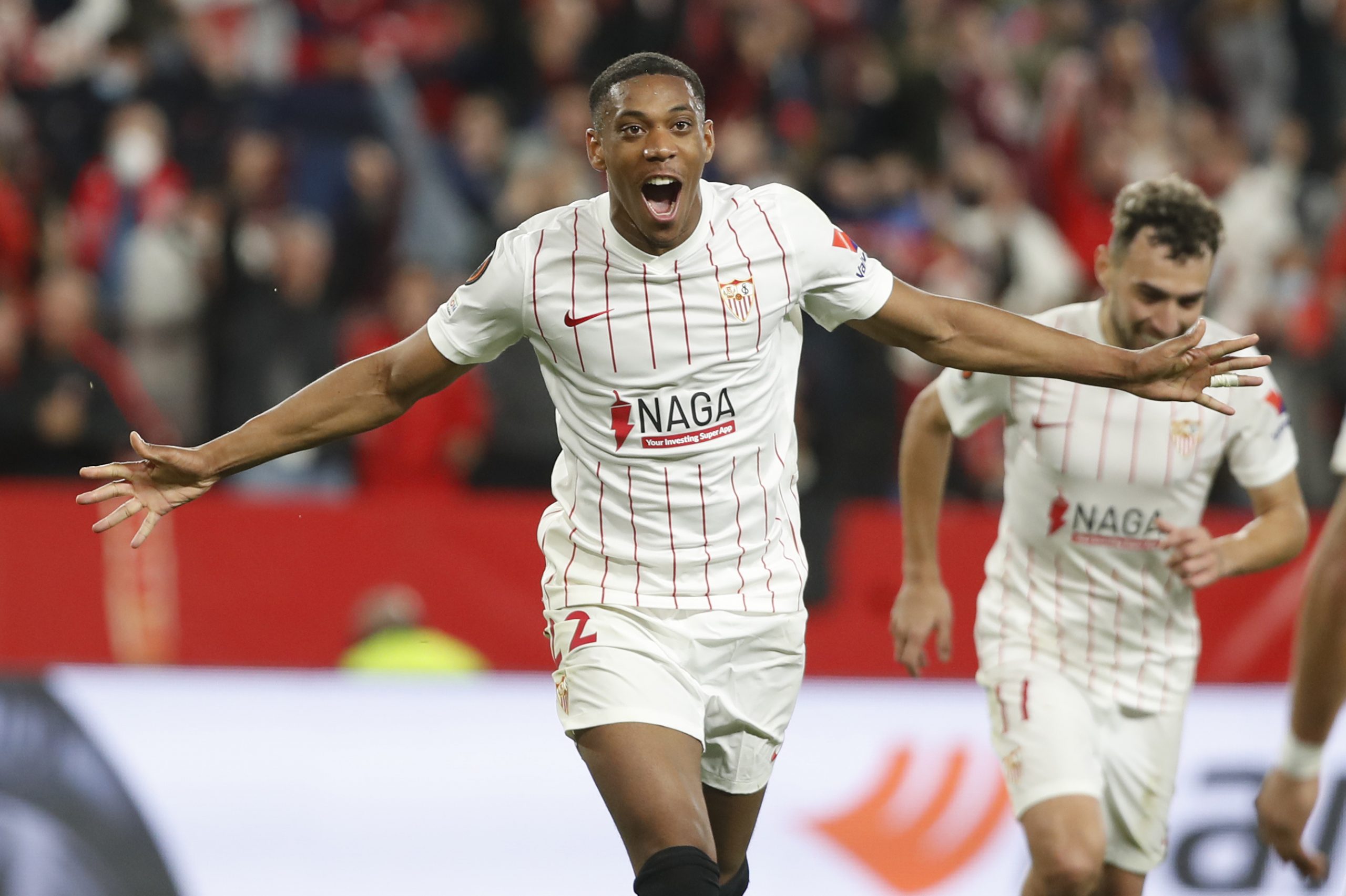 Sevilla's Anthony Martial celebrates after scoring his side's third goal during the Europa League soccer match between Sevilla and Dinamo Zagreb at the Ramon Sanchez-Pizjuan Stadium in Seville, Spain, Thursday, Feb. 17, 2022. (AP Photo/Miguel Morenatti)