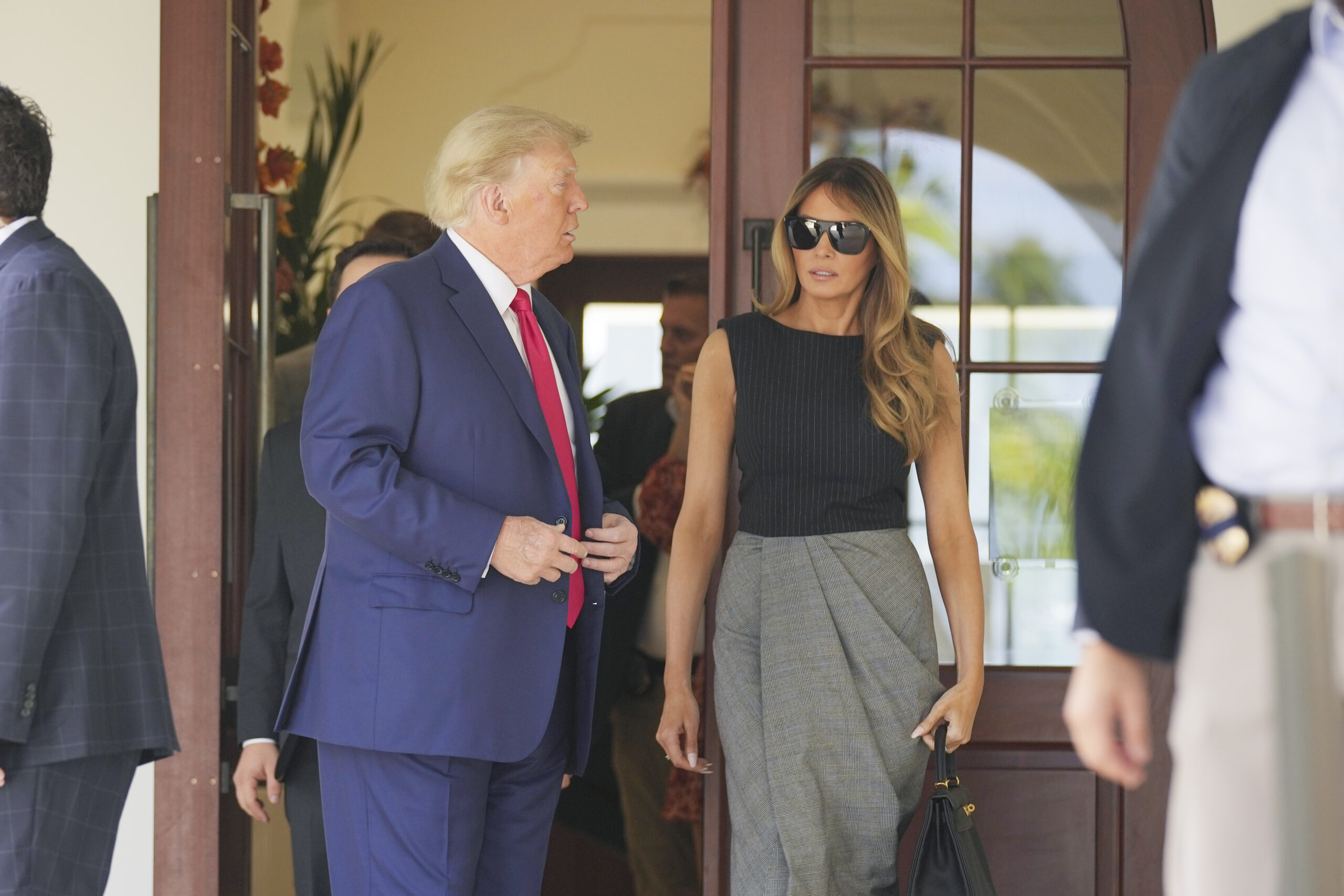 Former President Donald Trump walks out with Melania Trump, after voting at Morton and Barbara Mandel Recreation Center on Election Day, Tuesday, Nov. 8, 2022, in Palm Beach, Fla. (AP Photo/Andrew Harnik)