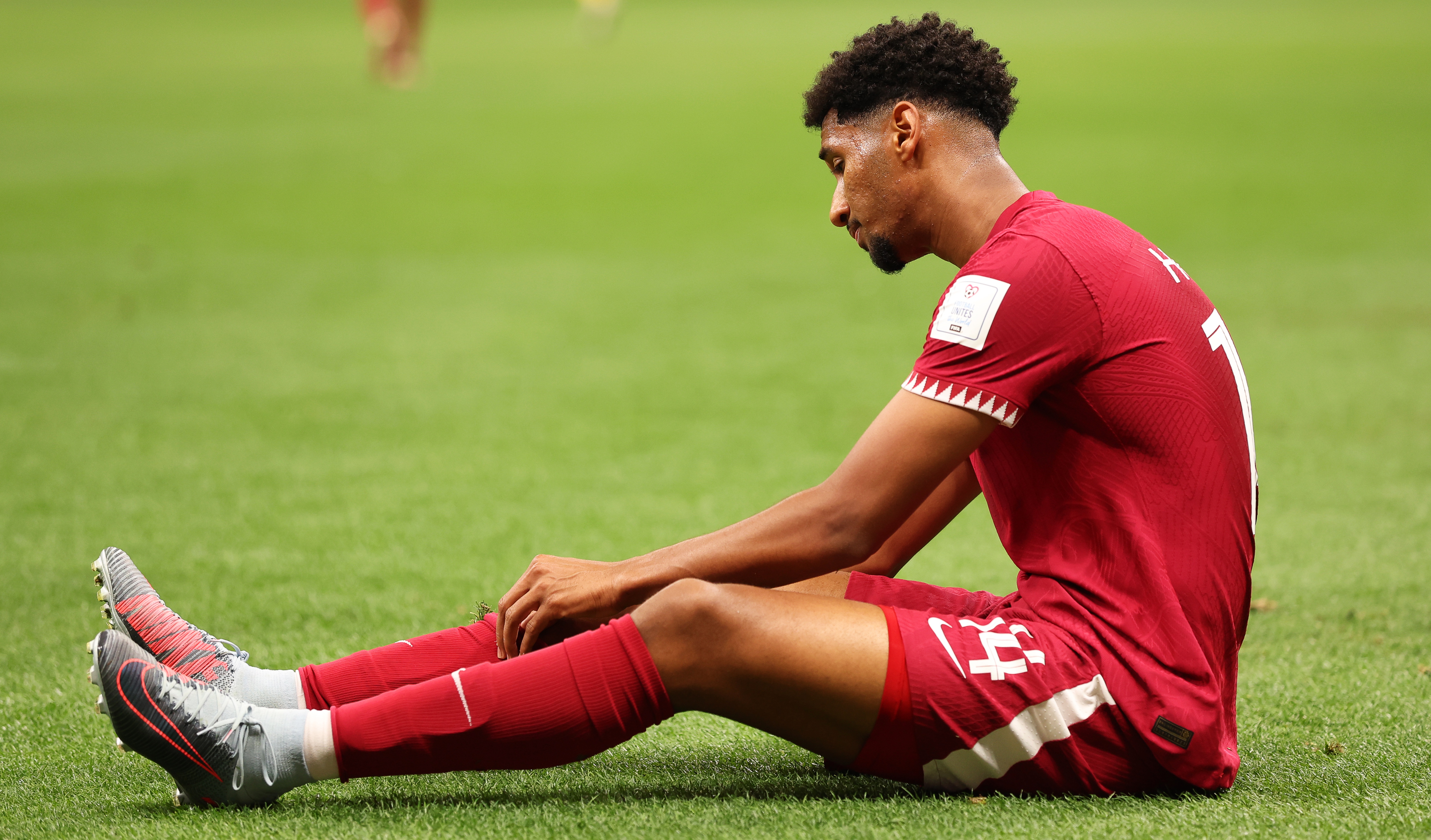 epa10316388 Homam Ahmed of Qatar reacts during the FIFA World Cup 2022 group A Opening Match between Qatar and Ecuador at Al Bayt Stadium in Al Khor, Qatar, 20 November 2022.  EPA-EFE/Tolga Bozoglu