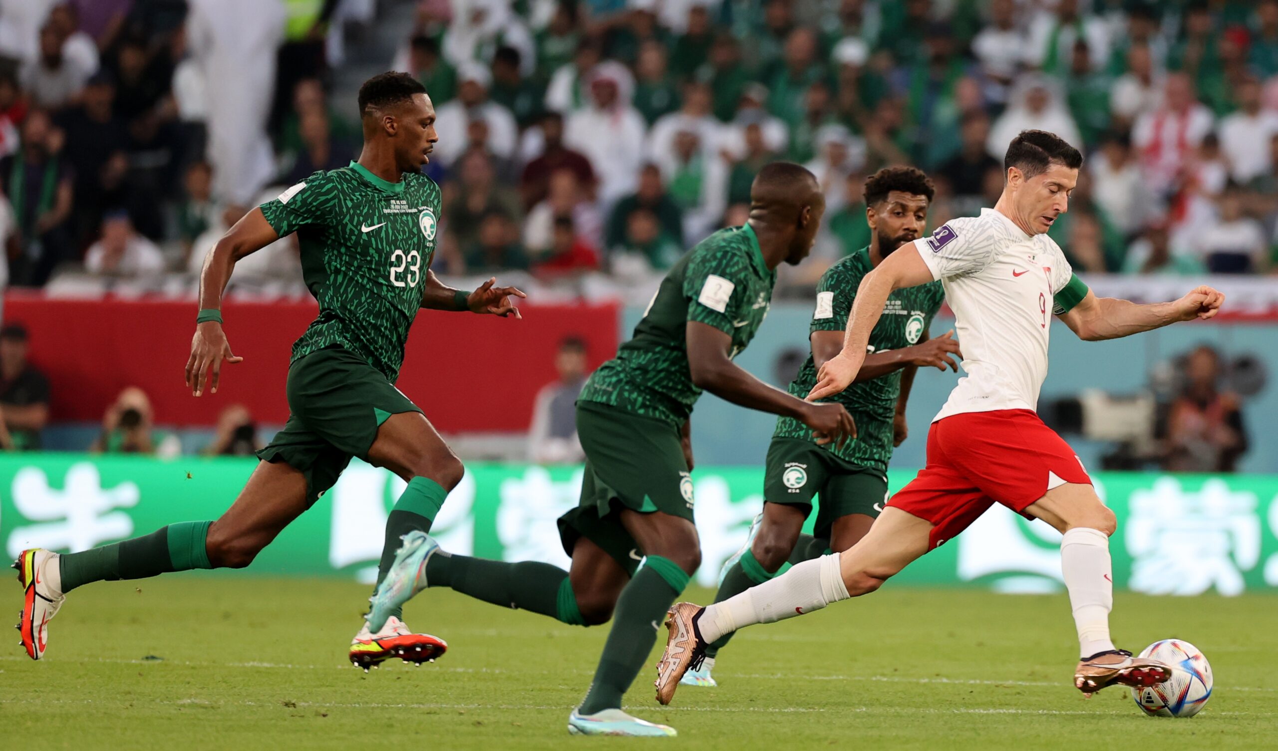 epa10329927 Robert Lewandowski (R) of Poland in action during the FIFA World Cup 2022 group C soccer match between Poland and Saudi Arabia at Education City Stadium in Doha, Qatar, 26 November 2022.  EPA-EFE/Mohamed Messara