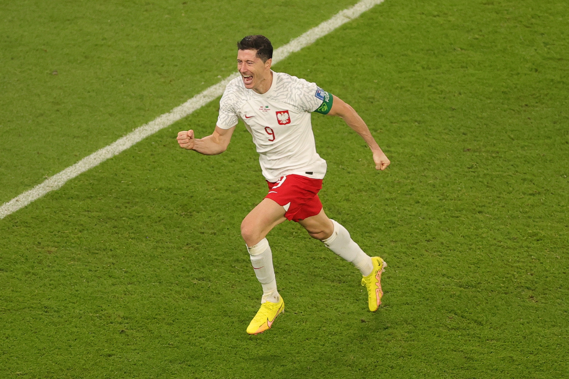 epa10330179 Robert Lewandowski of Poland celebrates after scoring the 2-0 during the FIFA World Cup 2022 group C soccer match between Poland and Saudi Arabia at Education City Stadium in Doha, Qatar, 26 November 2022.  EPA-EFE/Friedemann Vogel