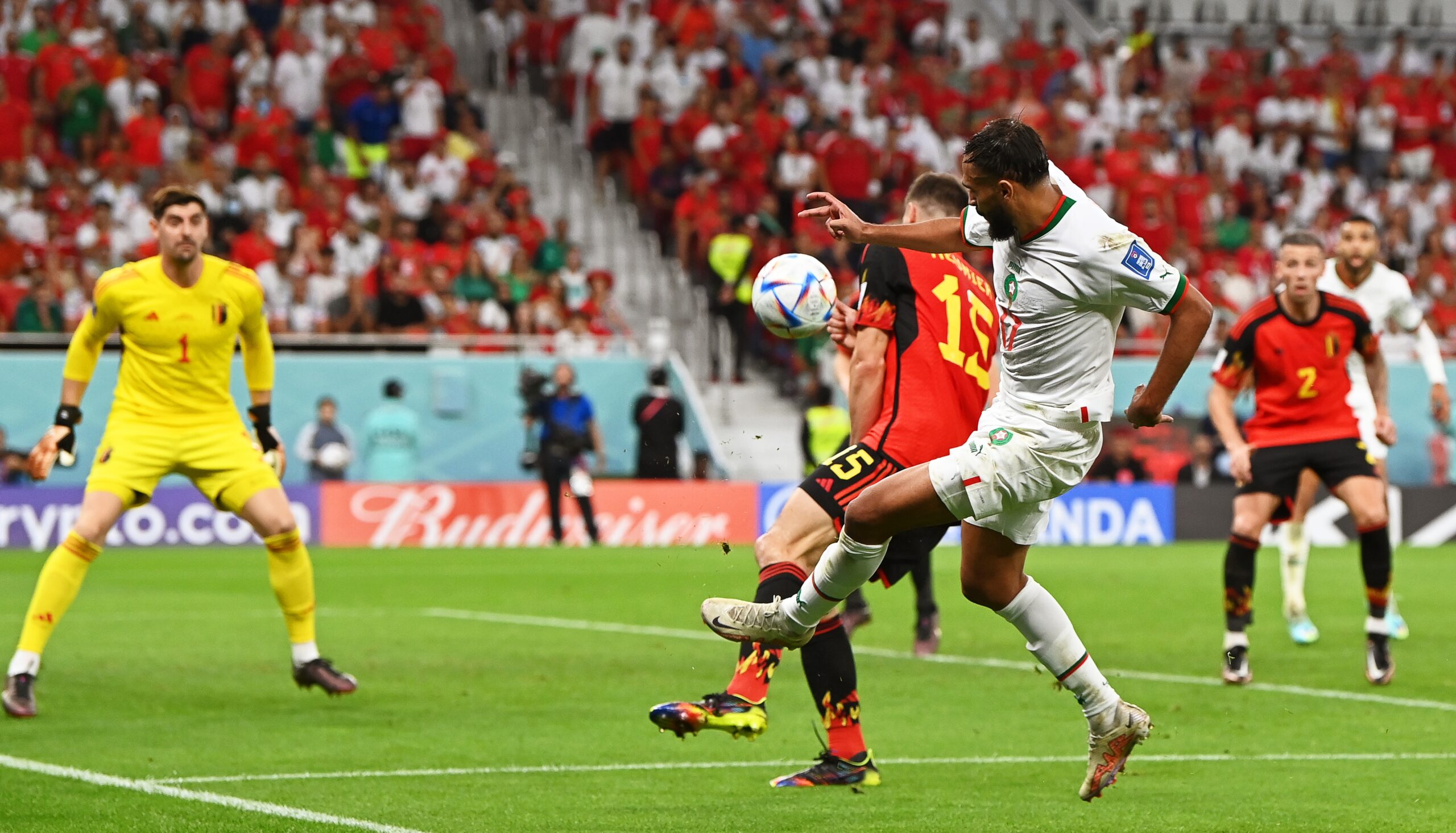 epa10332291 Sofiane Boufal (C-R) of Morocco in action during the FIFA World Cup 2022 group F soccer match between Belgium and Morocco at Al Thumama Stadium in Doha, Qatar, 27 November 2022.  EPA-EFE/Georgi Licovski