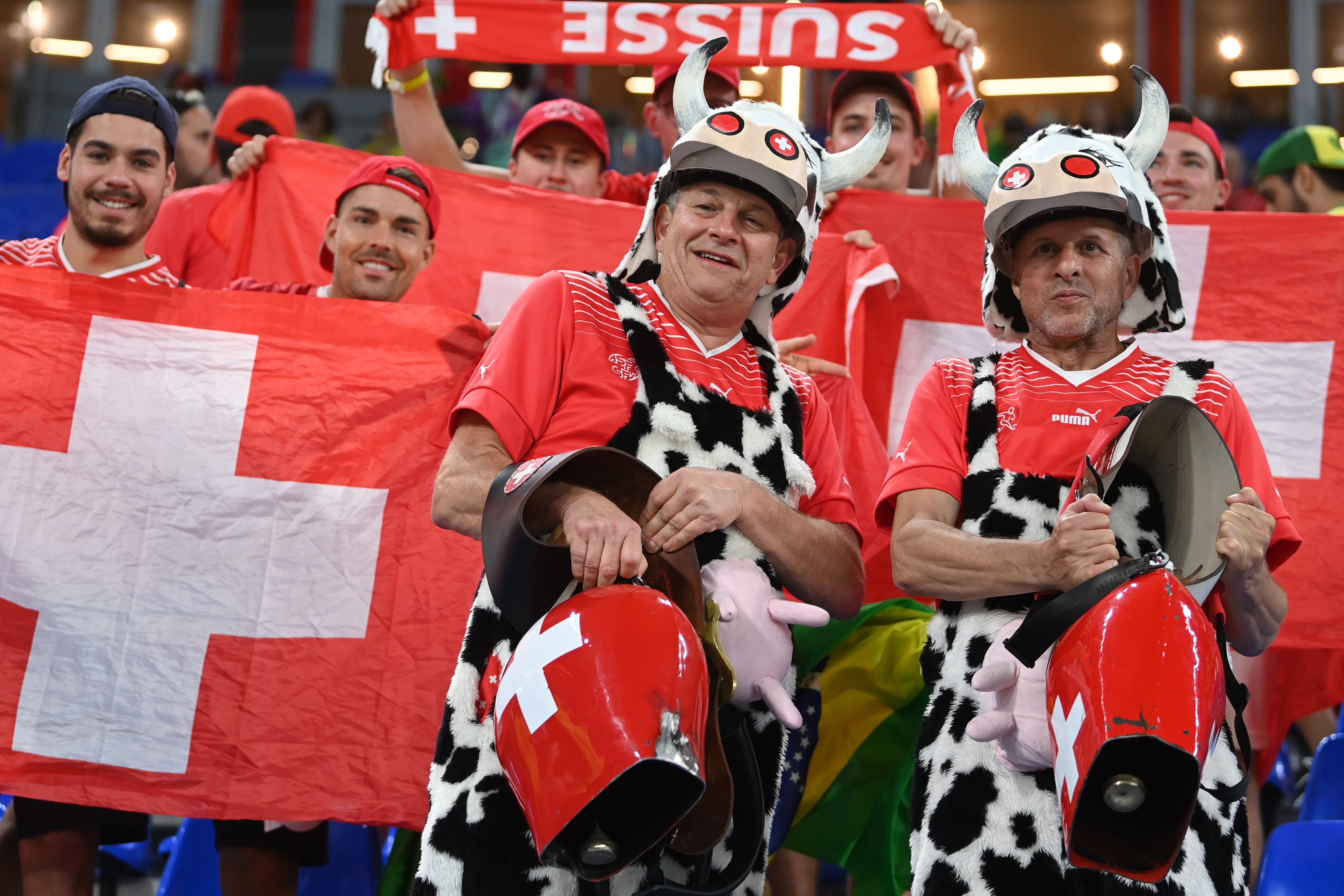 epa10334464 Supporters of Switzerland ring cowbells before the FIFA World Cup 2022 group G soccer match between Brazil and Switzerland at Stadium 947 in Doha, Qatar, 28 November 2022.  EPA-EFE/Neil Hall