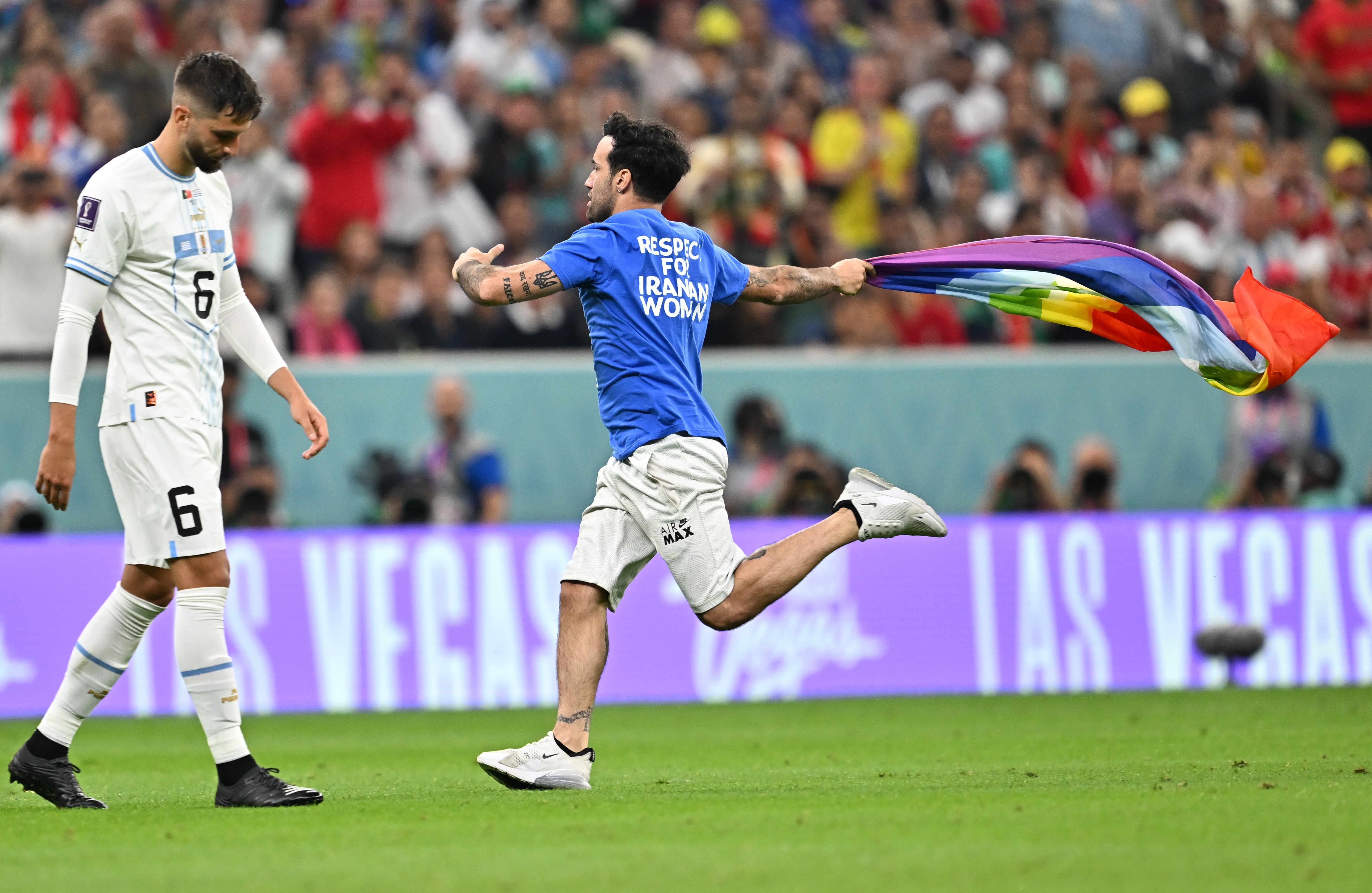epa10335309 A pitch invader during the FIFA World Cup 2022 group H soccer match between Portugal and Uruguay at Lusail Stadium in Lusail, Qatar, 28 November 2022.  EPA-EFE/Noushad Thekkayil