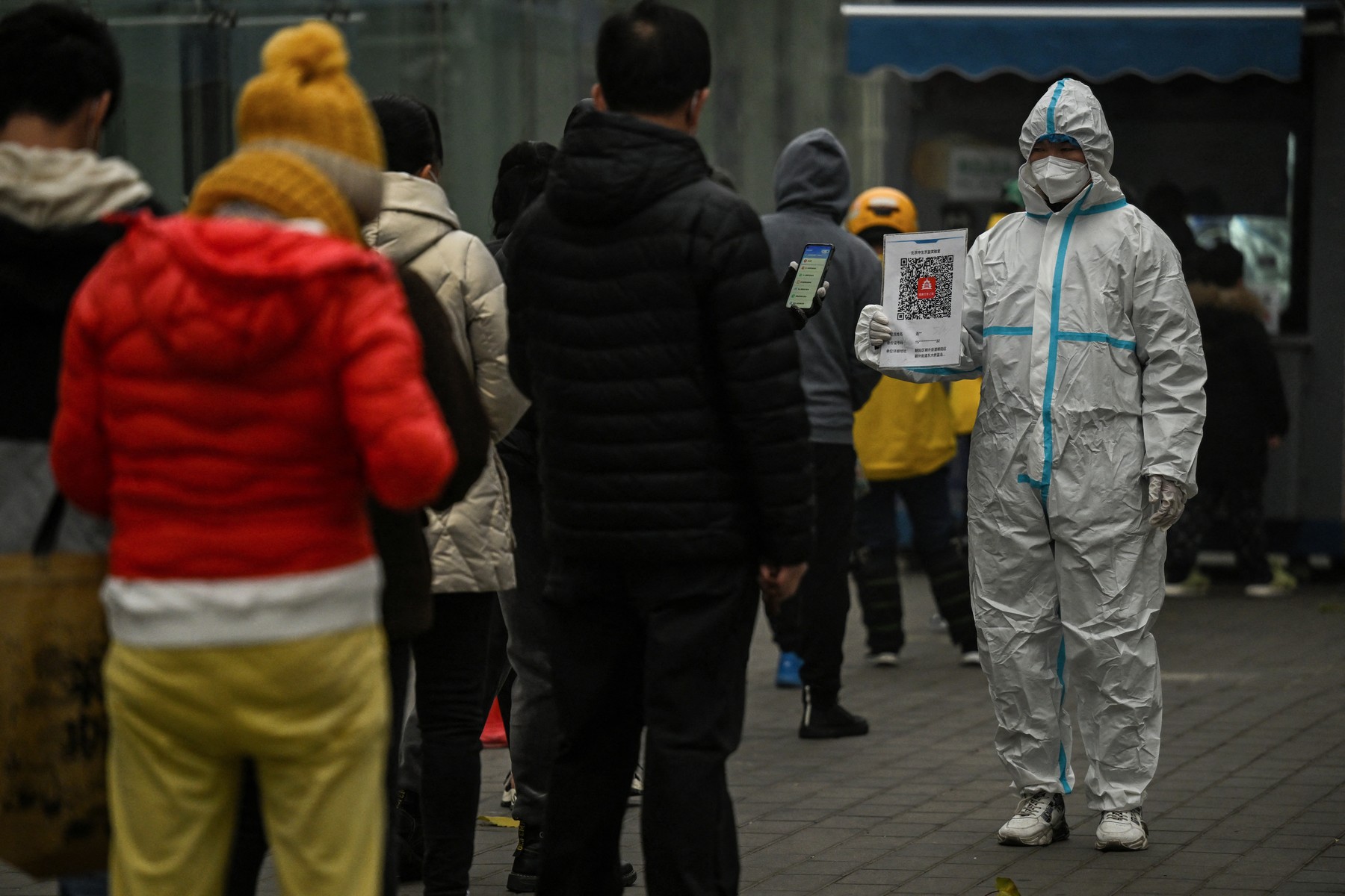 People queue to test for the Covid-19 coronavirus at a swab collection station in Beijing on November 20, 2022.,Image: 738852255, License: Rights-managed, Restrictions: , Model Release: no, Credit line: Noel CELIS / AFP / Profimedia