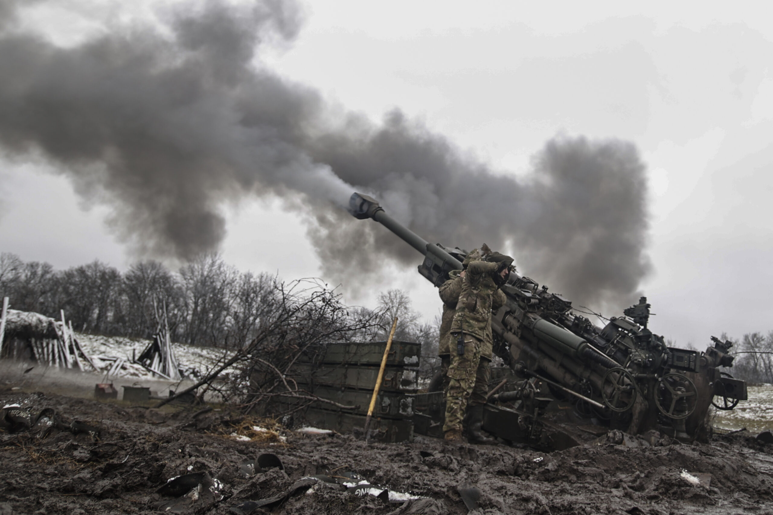 Ukrainian servicemen shoot towards Russian positions in the frontline at an undisclosed location in the Donetsk region, Ukraine, Wednesday, Nov. 23, 2022. (AP Photo/Roman Chop)