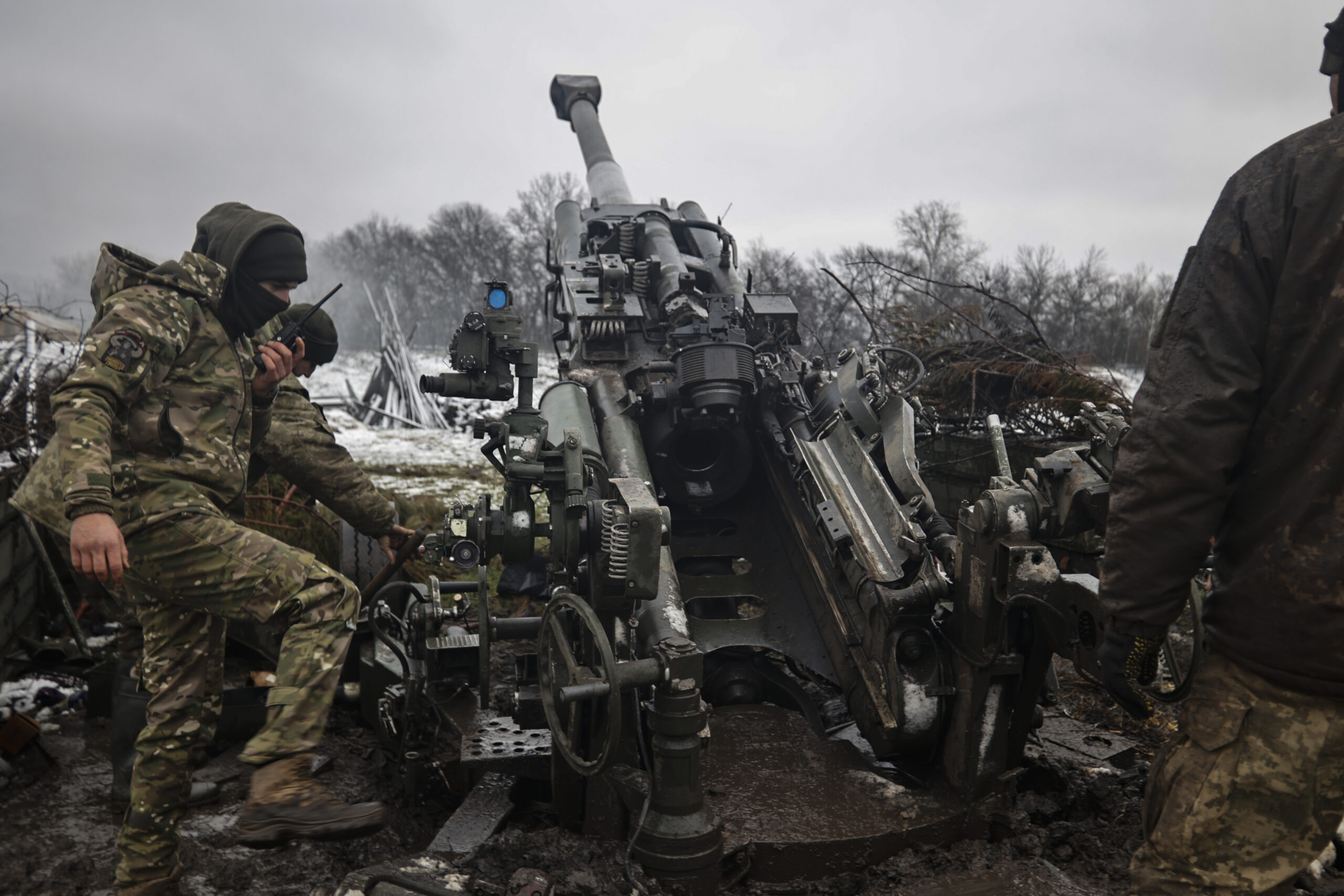 Ukrainian servicemen prepare to fire at Russian positions in the frontline at an undisclosed location in the Donetsk region, Ukraine, Wednesday, Nov. 23, 2022. (AP Photo/Roman Chop)