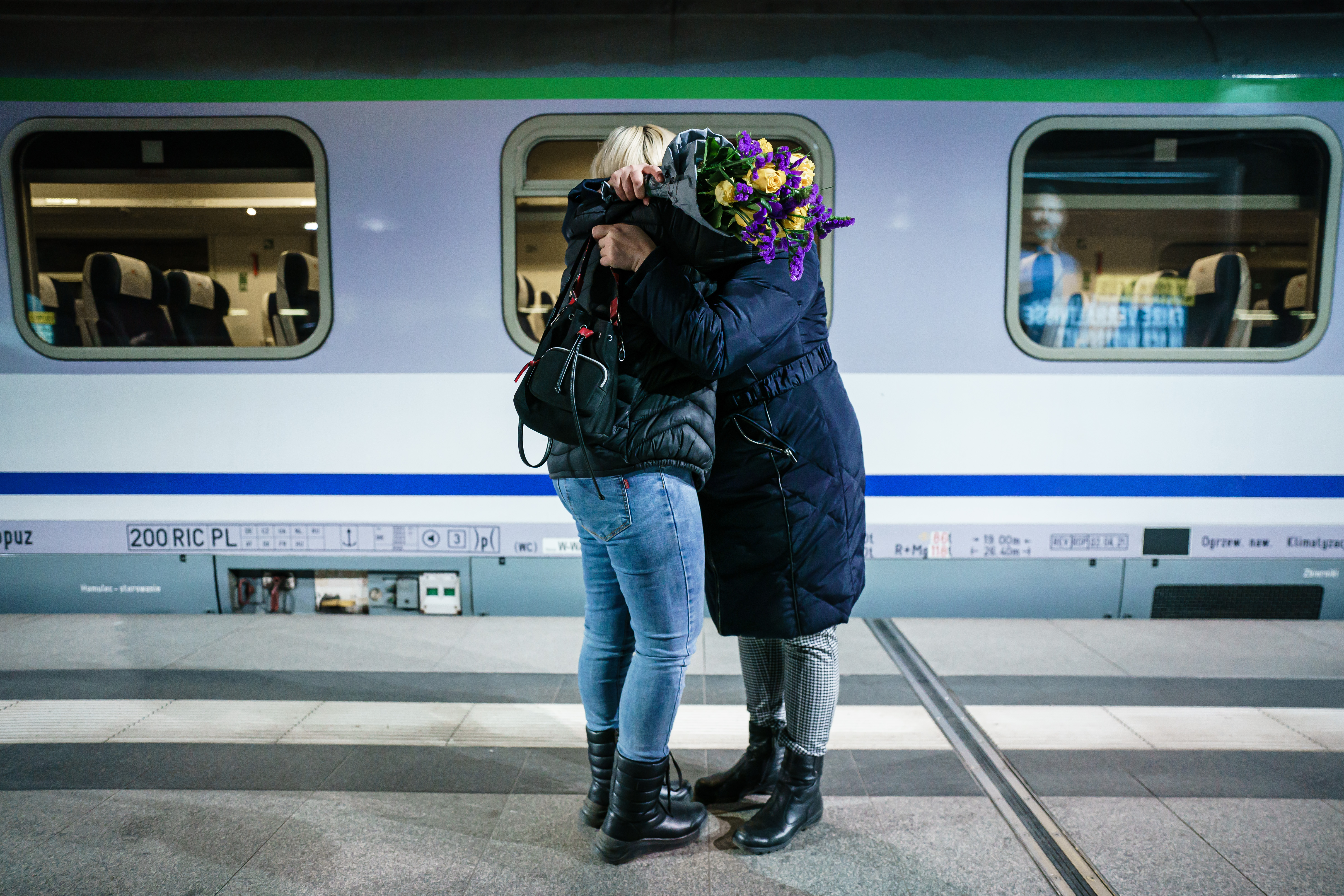 Refugees arrive by train at Berlin central station