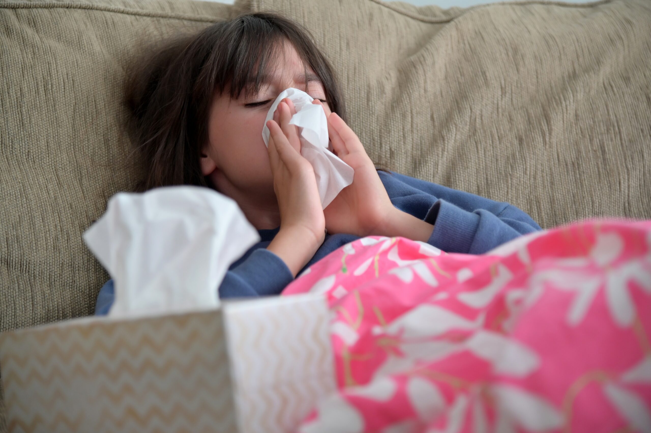 Young sick girl (female age 10-11) covered with blanket blowing her nose with tissue paper.,,Image: 606713863, License: Rights-managed, Restrictions: , Model Release: no, Credit line: Rafael Ben-Ari / Avalon / Avalon / Profimedia