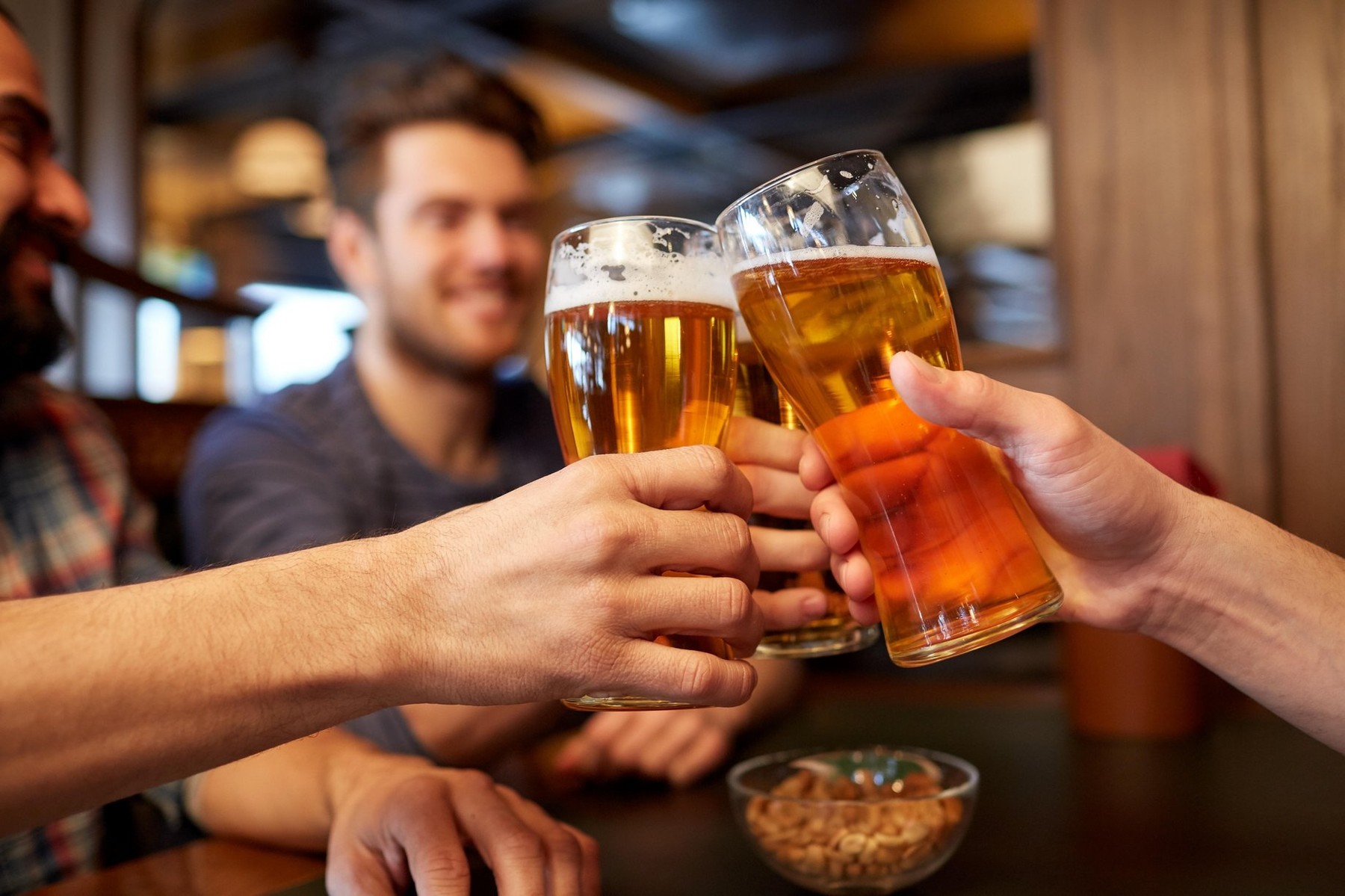 happy male friends drinking beer at bar or pub