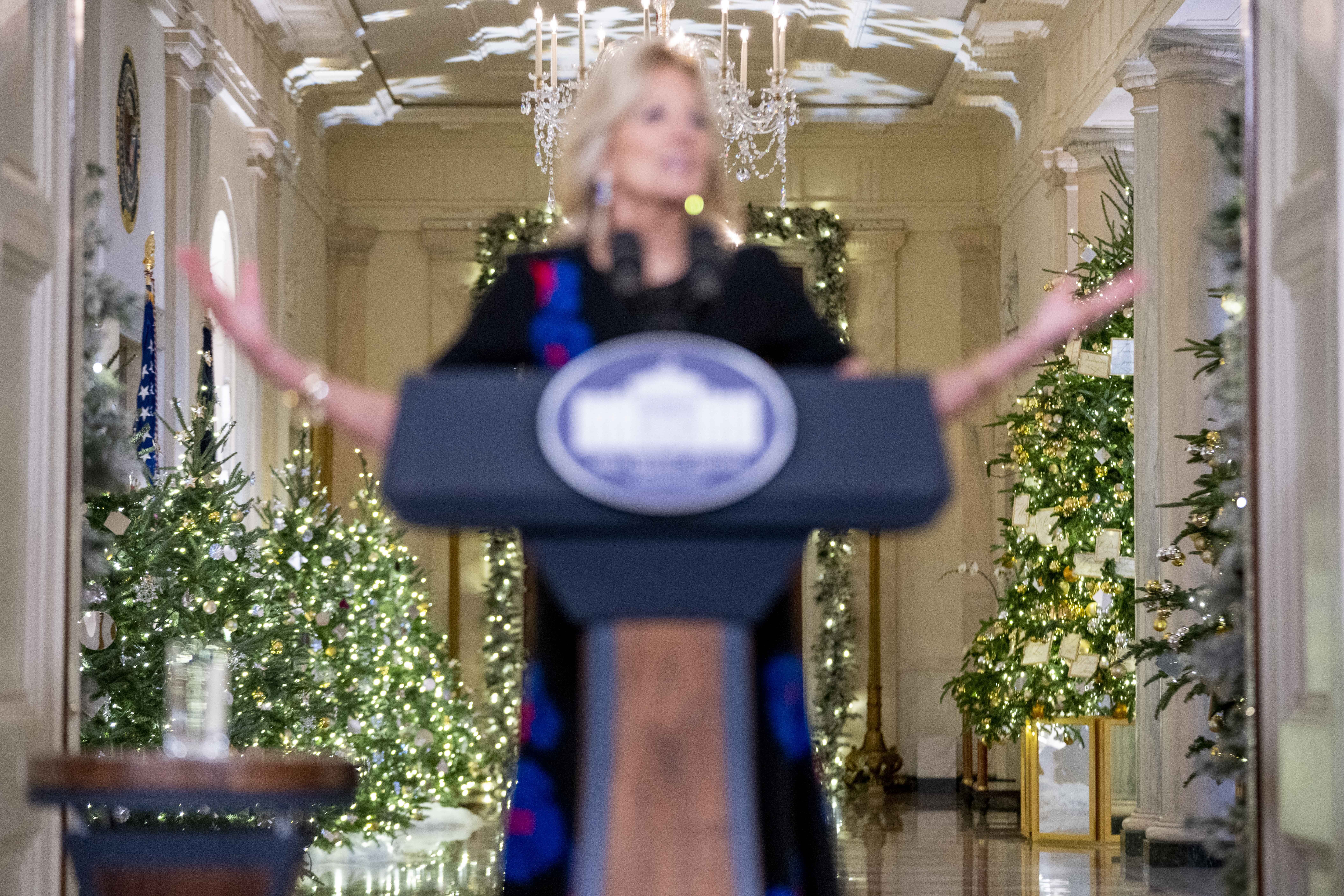 Seasonal decorations are seen as first lady Jill Biden speaks at an unveiling of this year's White House holiday theme and seasonal decor in the East Room at the White House in Washington, Monday, Nov. 28, 2022. (AP Photo/Andrew Harnik)