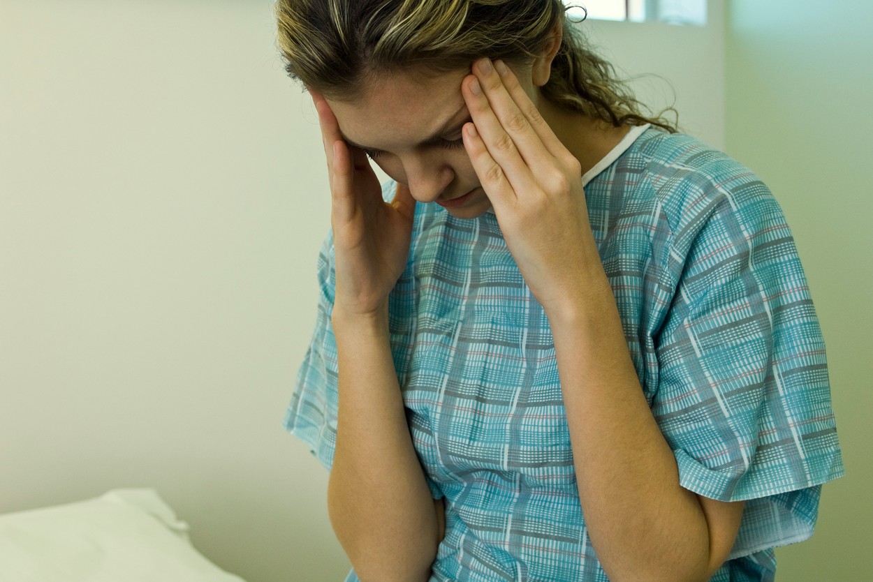 Patient with headache holding head,Image: 76887948, License: Royalty-free, Restrictions: , Model Release: yes, Credit line: Michele Constantini / PhotoAlto / Profimedia