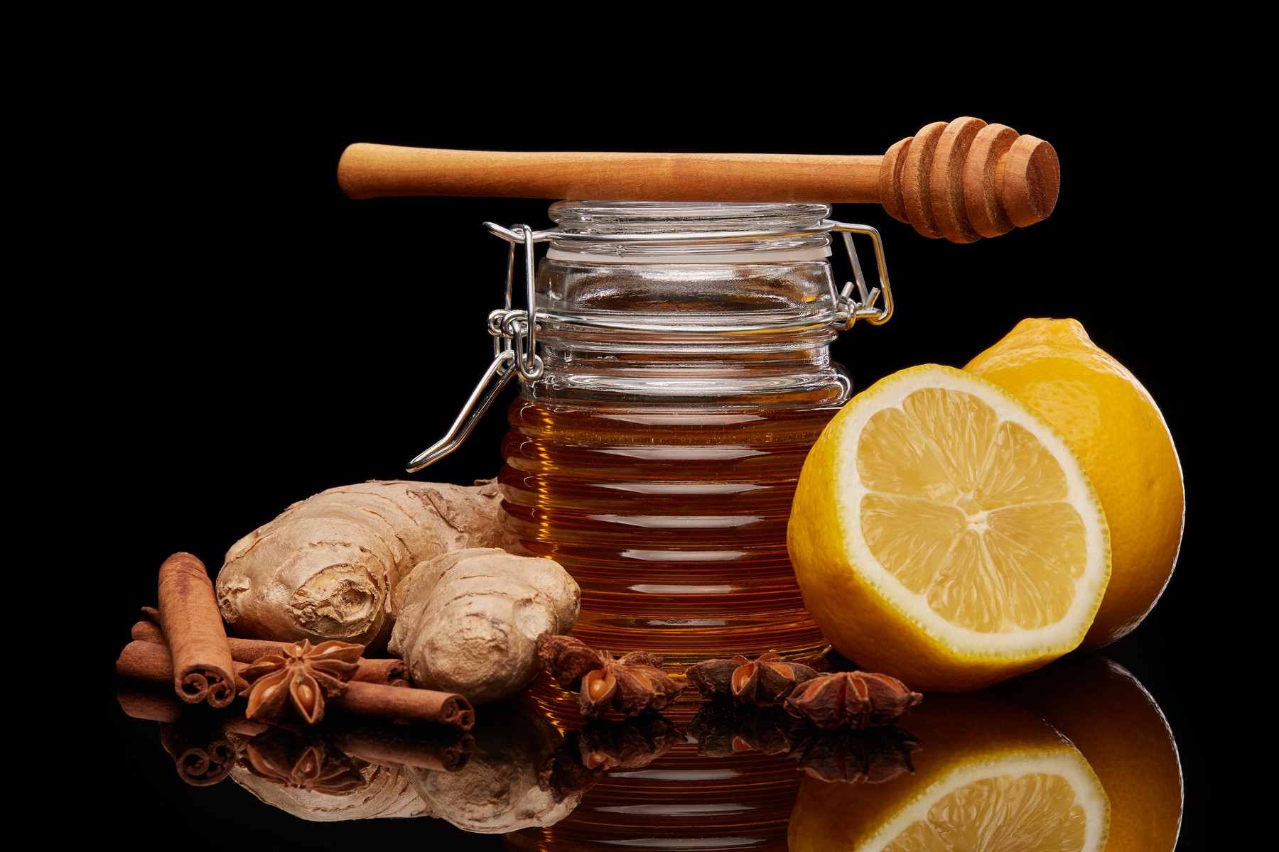 Natural honey in a pot ,  honey dipper,  lemon,  ginger and spices on a black background.,Image: 315635621, License: Royalty-free, Restrictions: , Model Release: no, Credit line: Dmitriy Melnikov / Panthermedia / Profimedia