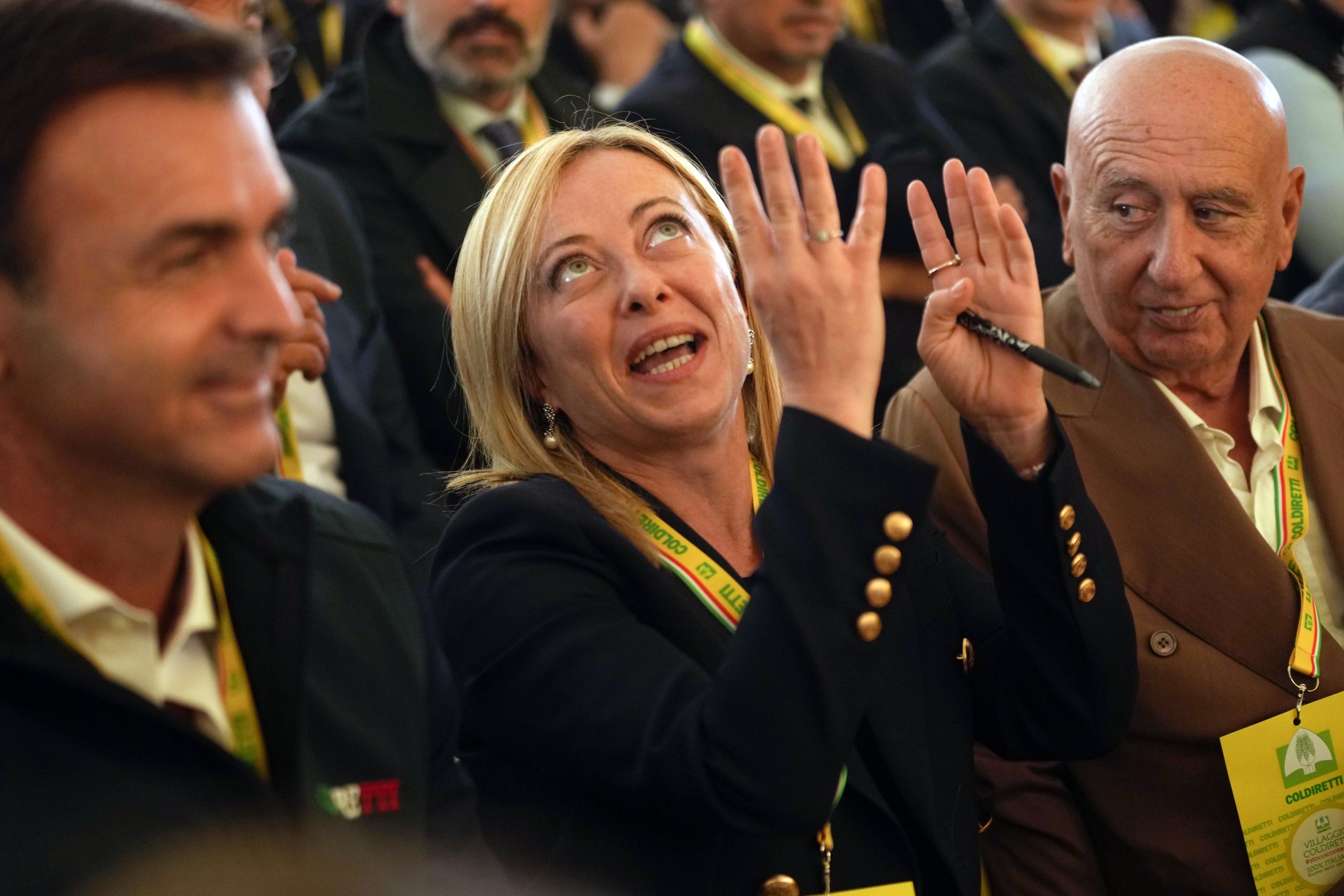 Brothers of Italy leader Giorgia Meloni gestures prior to speaks during an Italian farmers association's event, at the Sforzesco Castle in Milan, Italy, Saturday, Oct. 1, 2022. (AP Photo/Luca Bruno)