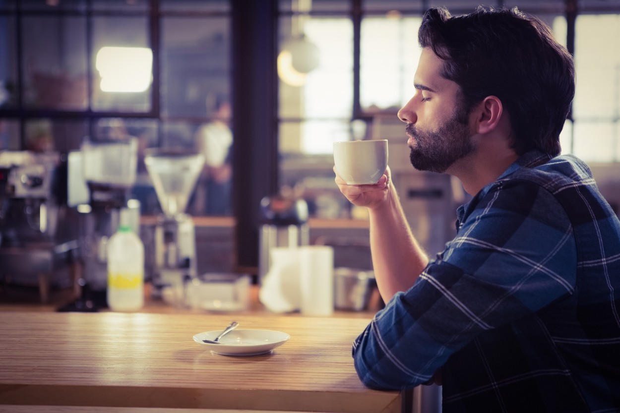 Worried man drinking a coffee at the cafe,Image: 258224556, License: Royalty-free, Restrictions: , Model Release: yes, Credit line: - / Wavebreak / Profimedia