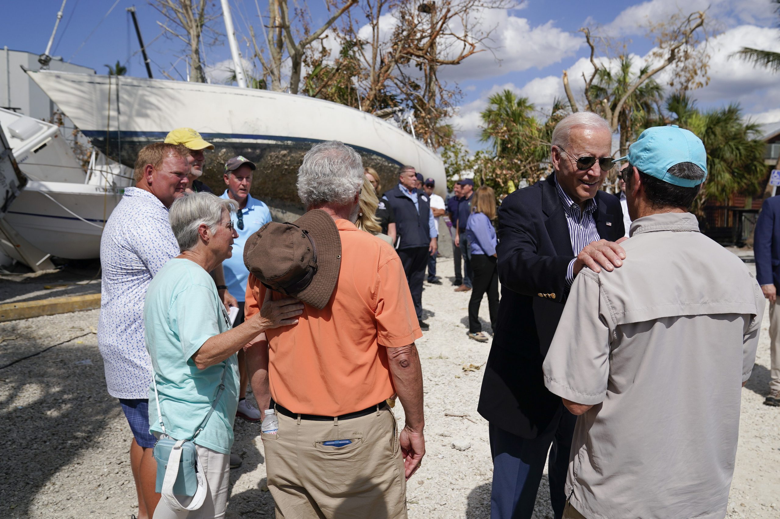 President Joe Biden talks to people impacted by Hurricane Ian as he tours the area on Wednesday, Oct. 5, 2022, in Fort Myers Beach, Fla. (AP Photo/Evan Vucci)