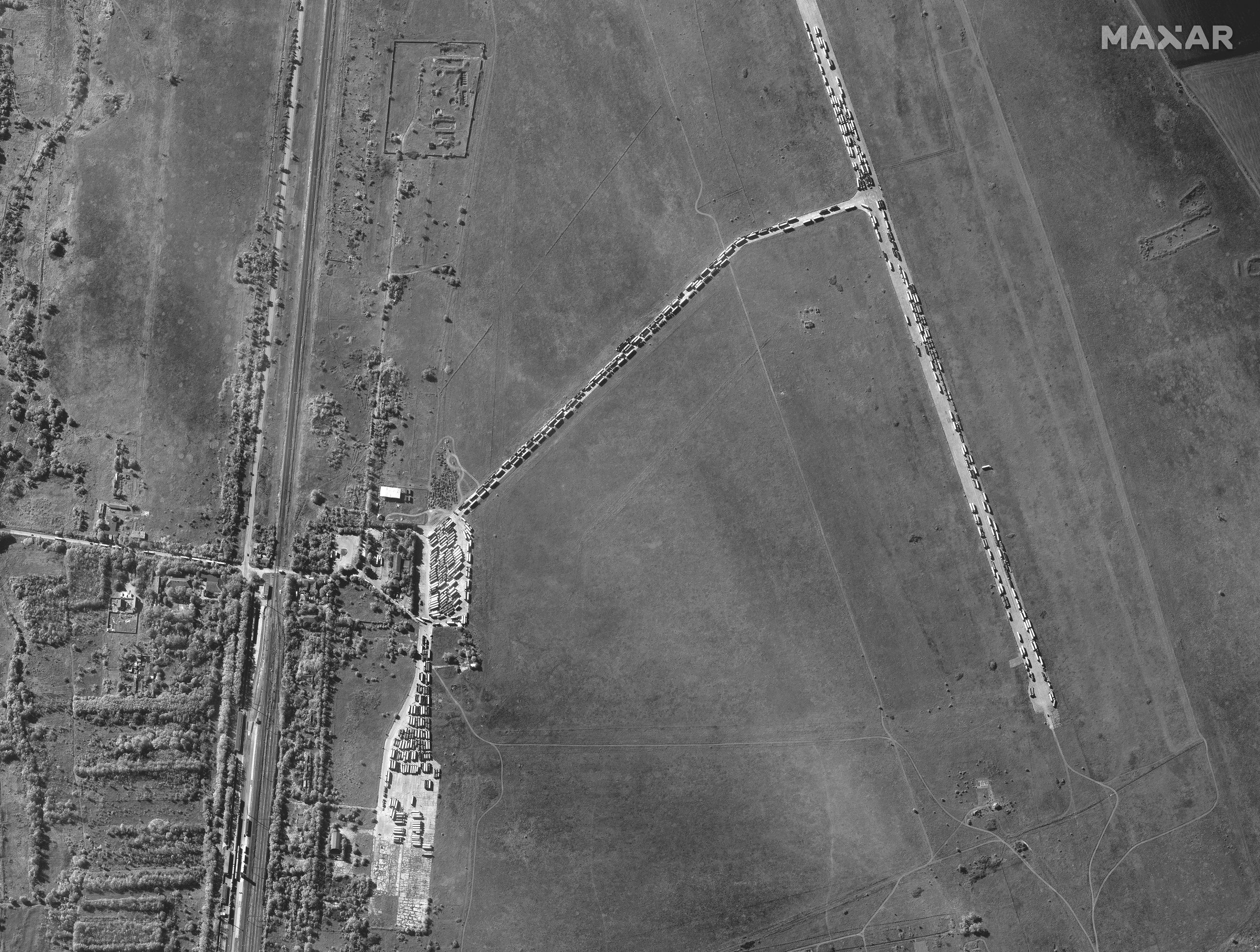 This satellite image provided by Maxar Technologies shows cargo trucks waiting in Kerch, Crimean Peninsula, on Wednesday, Oct. 12, 2022, after a bridge connecting Kerch and Russia was damaged by an explosion on Oct. 8. (Maxar Technologies via AP)